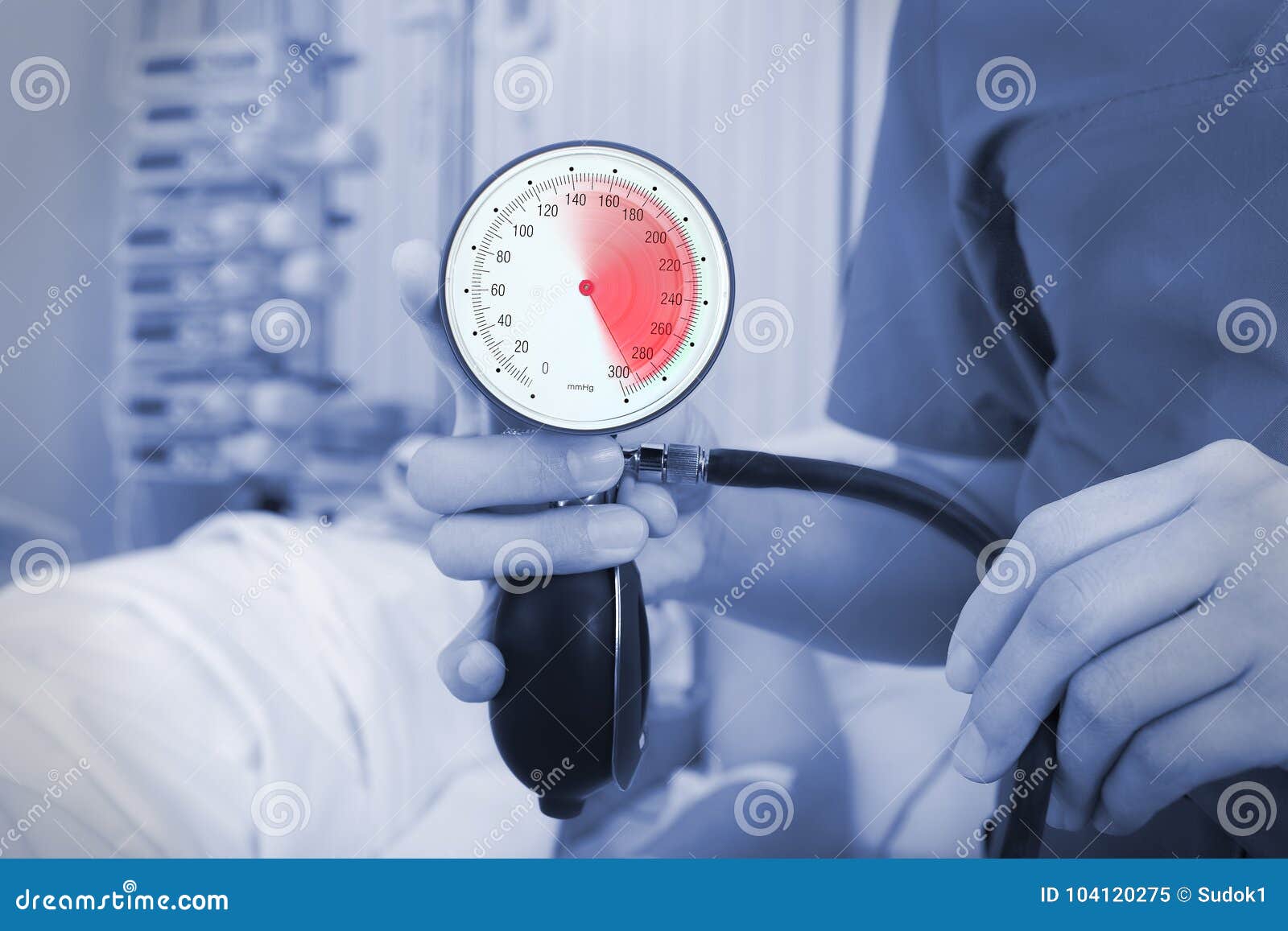 Manometer in the Doctors Hand on the Background of Patient Lying Stock
