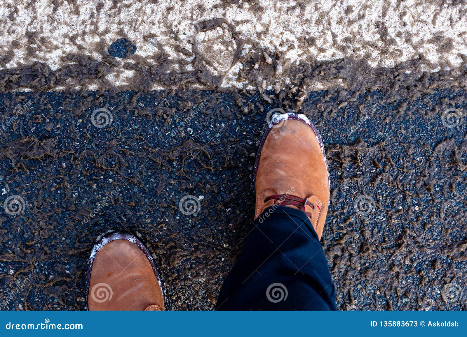 Mans Feet in Winter Boots on Dirty Snow in the Streets Stock Image ...