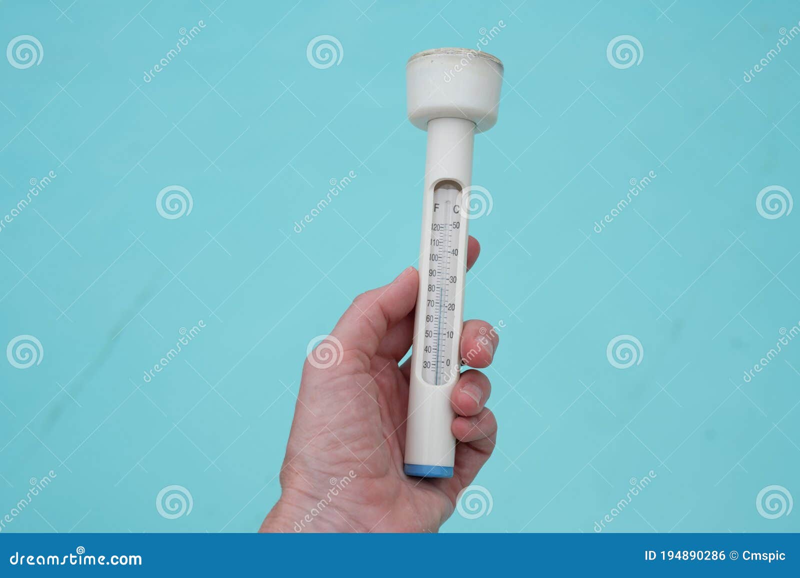 Mans Hand Holding a Thermometer Stock Photo Image of temp