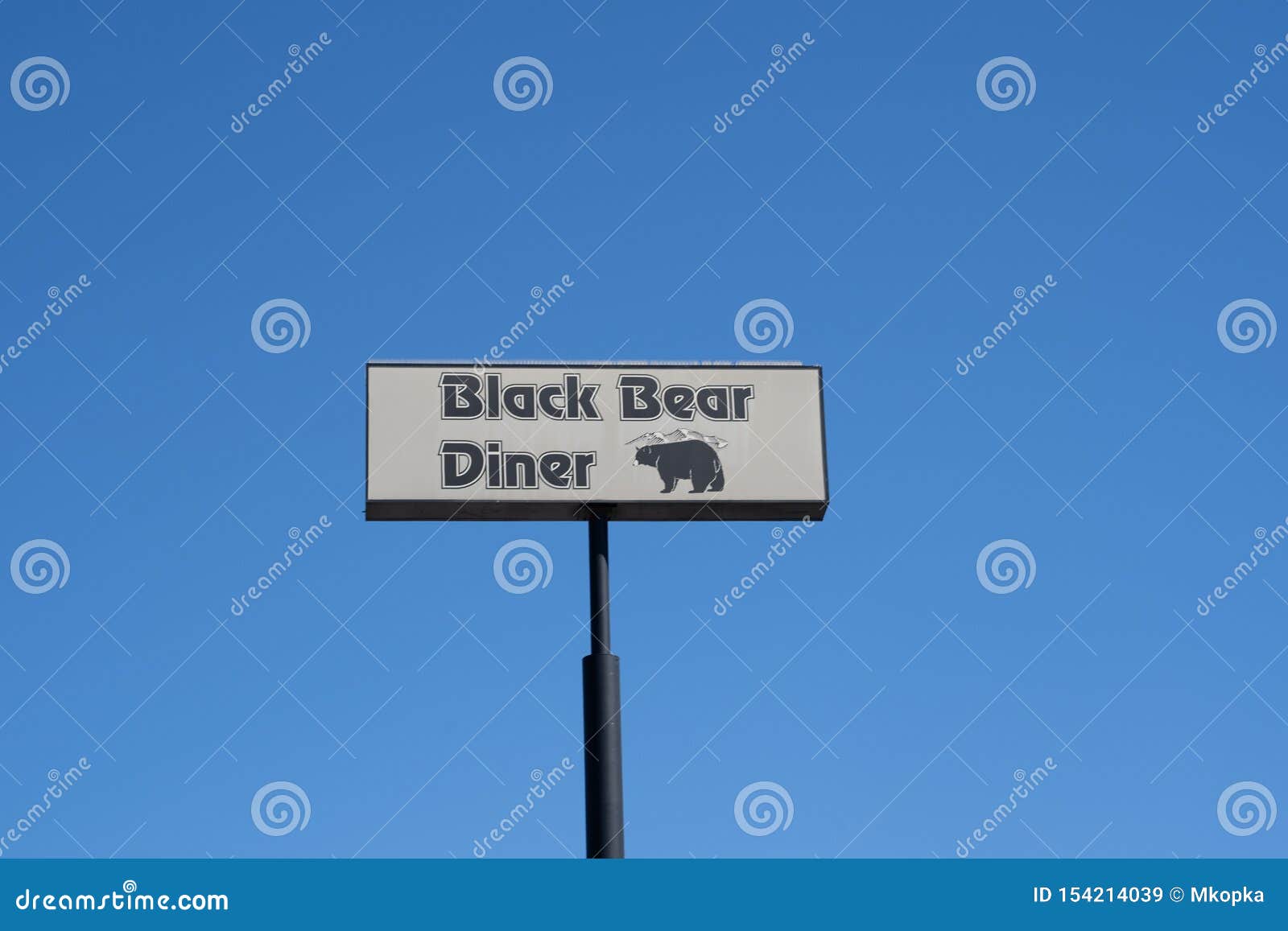 Sign for the Black Bear Diner Against a Blue Sky, Known for Serving