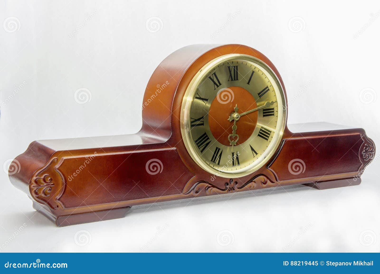 ANTIQUE MANTEL CLOCK WITH GOLDEN STATUETTES RoyaltyFree Stock Image