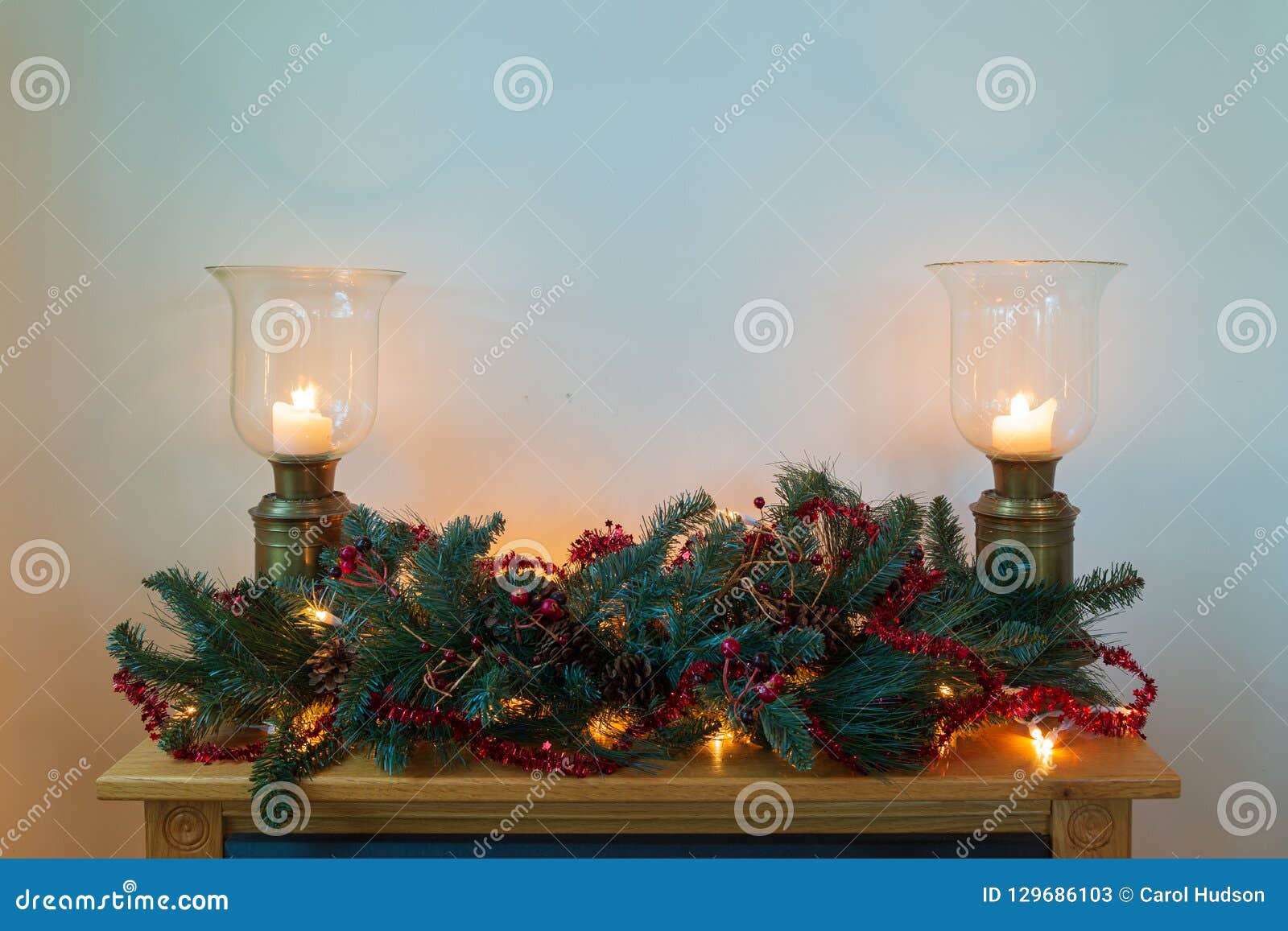 Mantle with Green and Red Wreath and Bronze Candle Holders. Stock Image ...