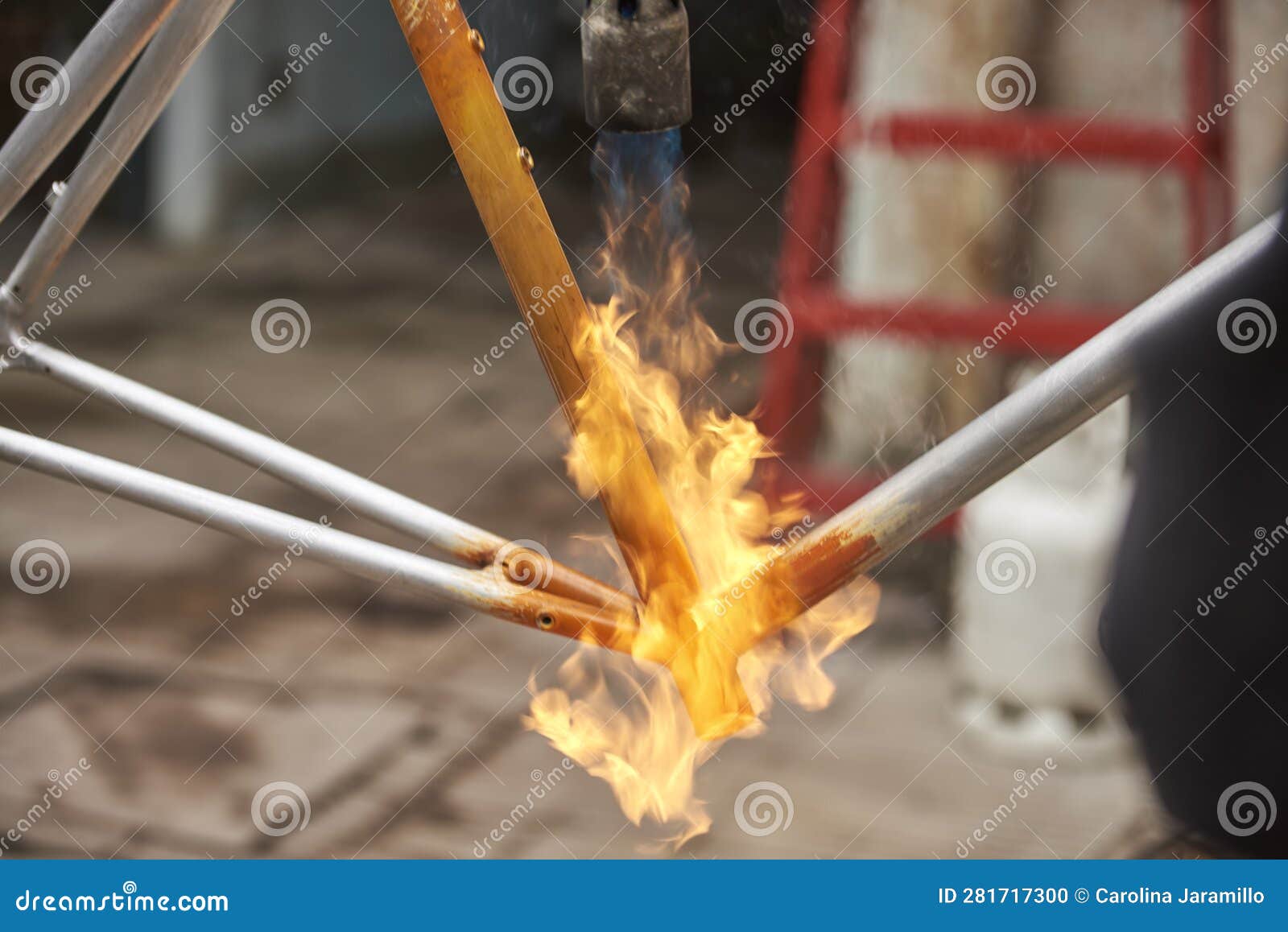 Manual Bicycle Renovation Work, Paint Removal Process Using a Torch