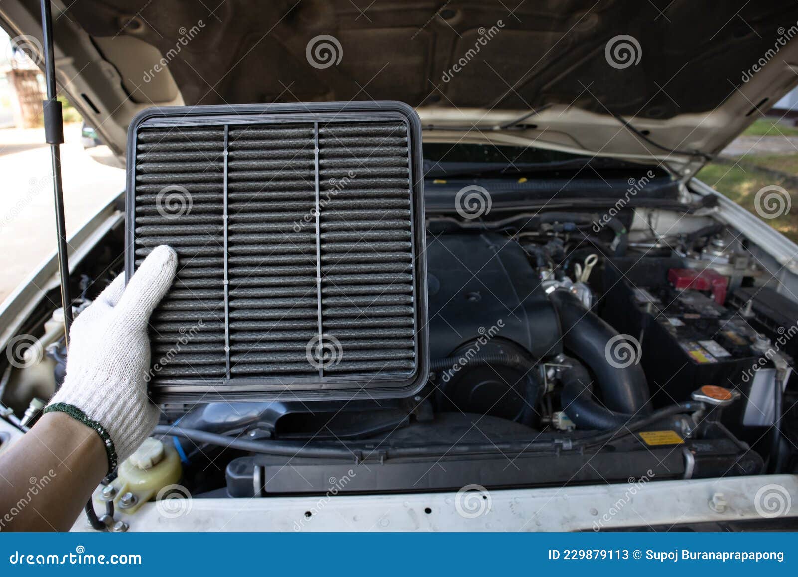 Manual Car Air Filter Replacement To Maintain Engine Performance.Air