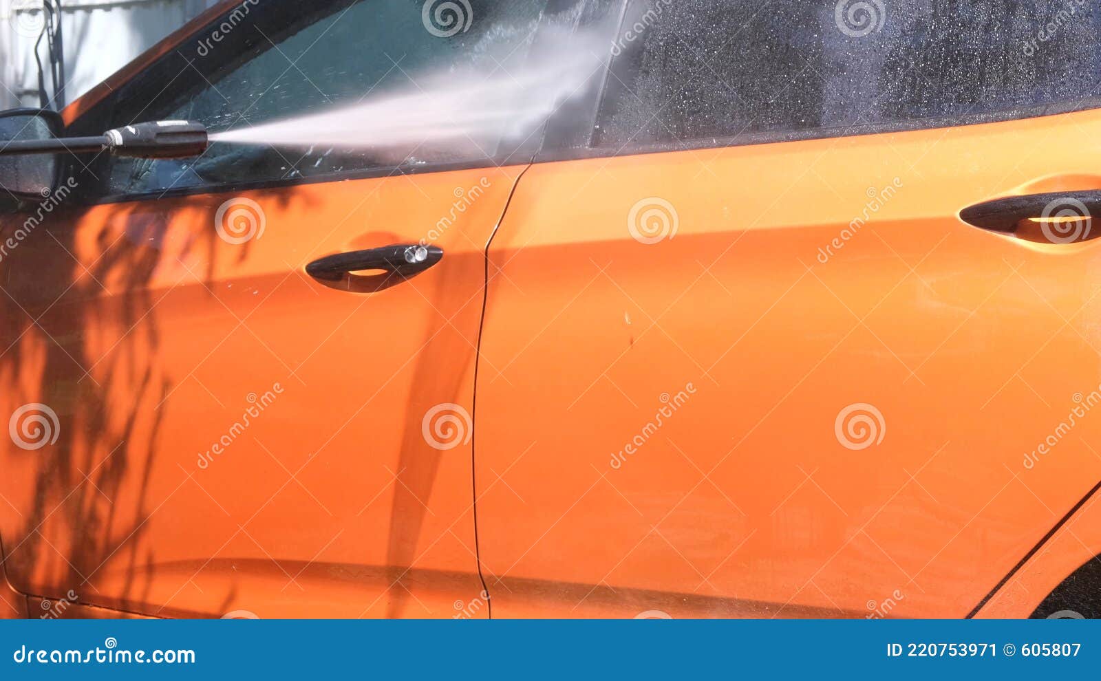 Manual Car Wash with Pressurized Water in Car Wash Outside in Summer