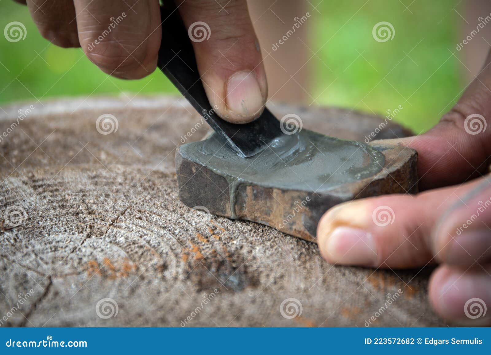 Manual Sharpening of Wooden Chisel on a Grinding Stone. Craftsman Works Stock Photo Image of