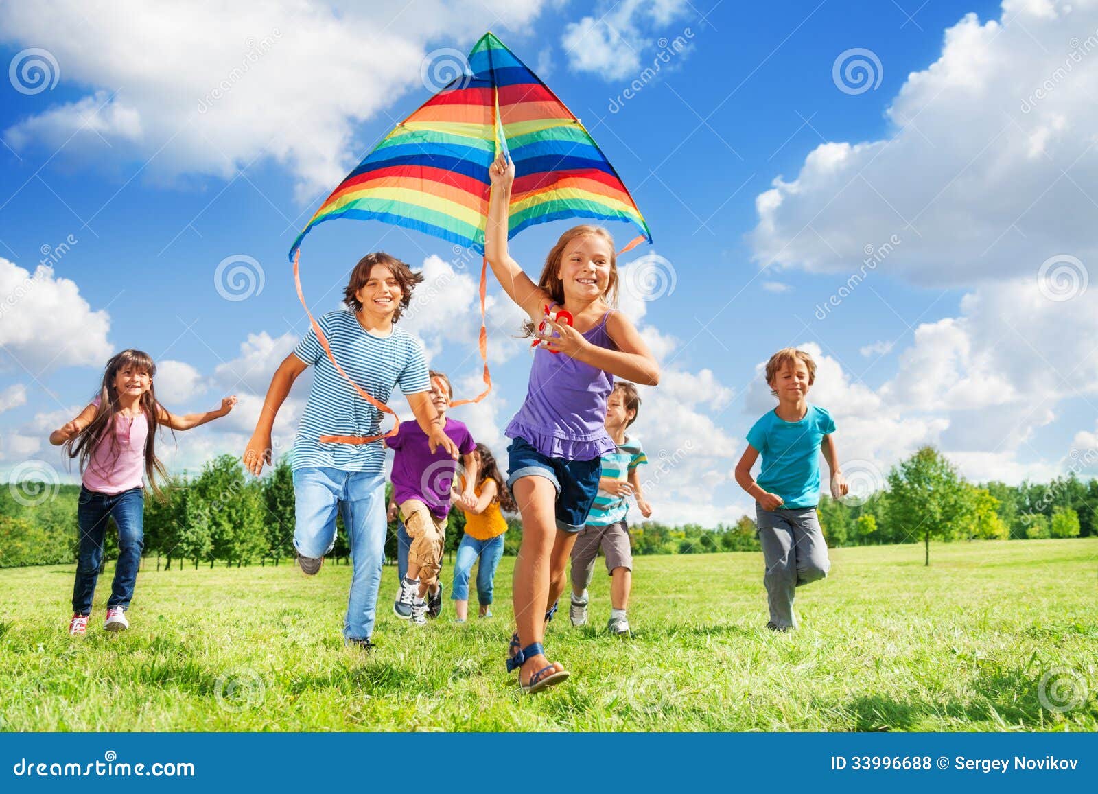 many active kids with kite