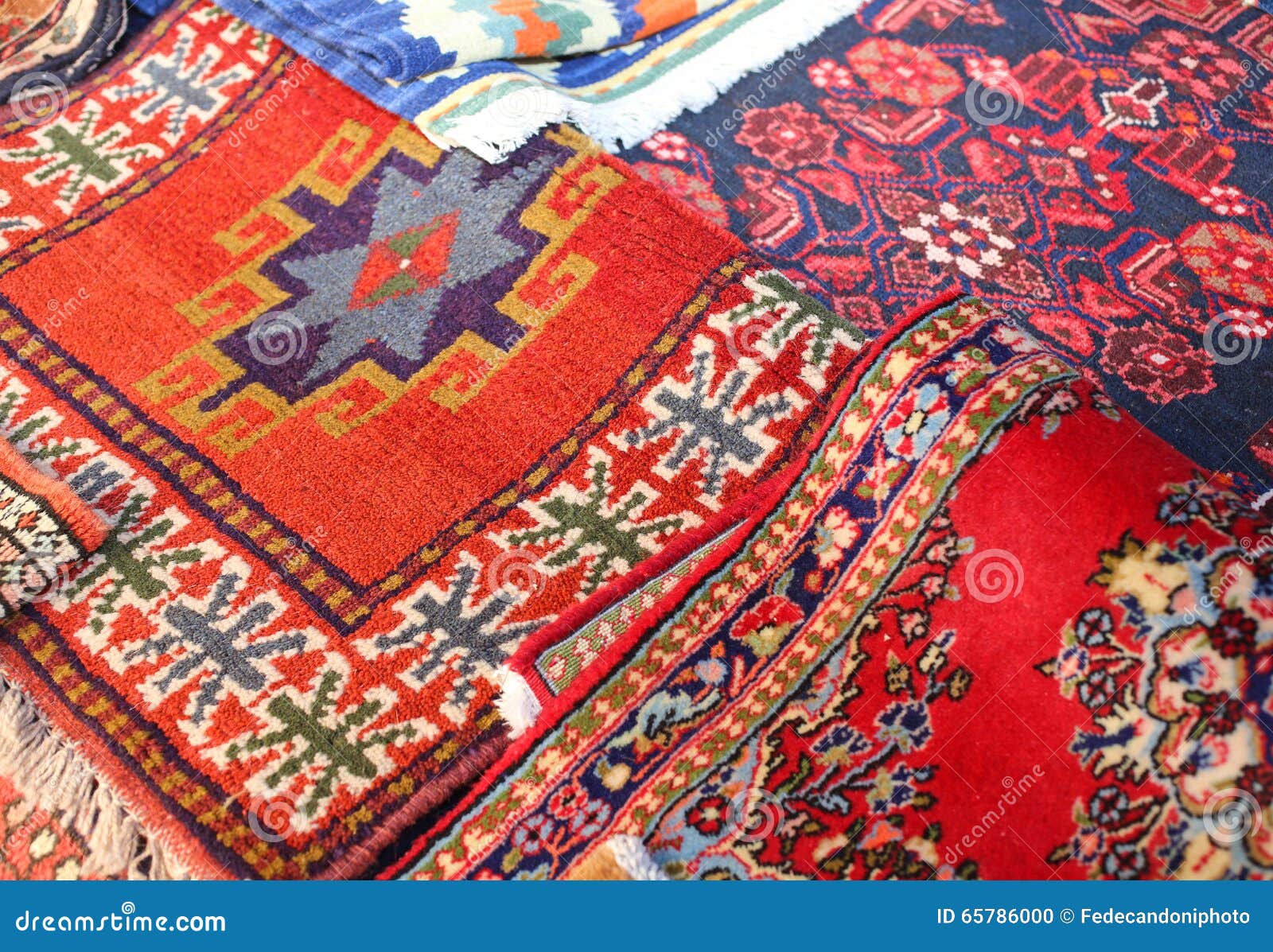 Many Ancient Colored Wool Carpets Made by Hand in the Middle East Stock