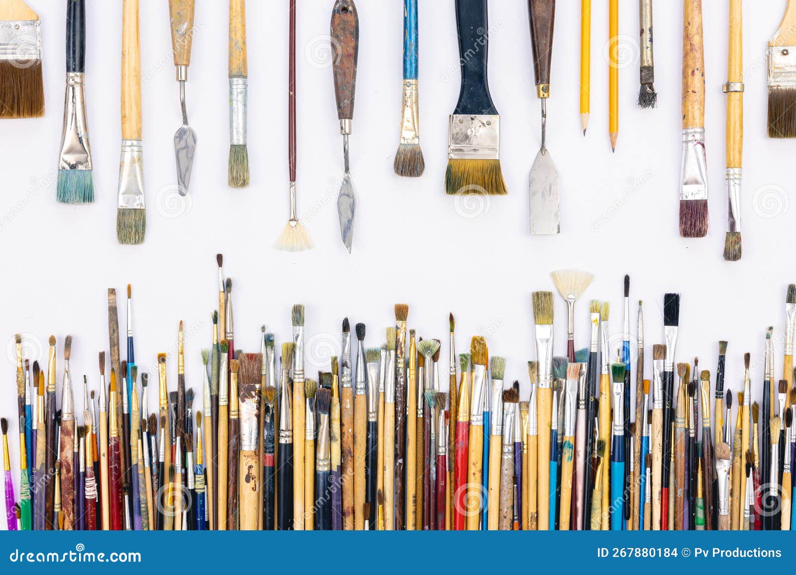 Many brushes for painting on a white background, top view. Stock Photo by  puhimec