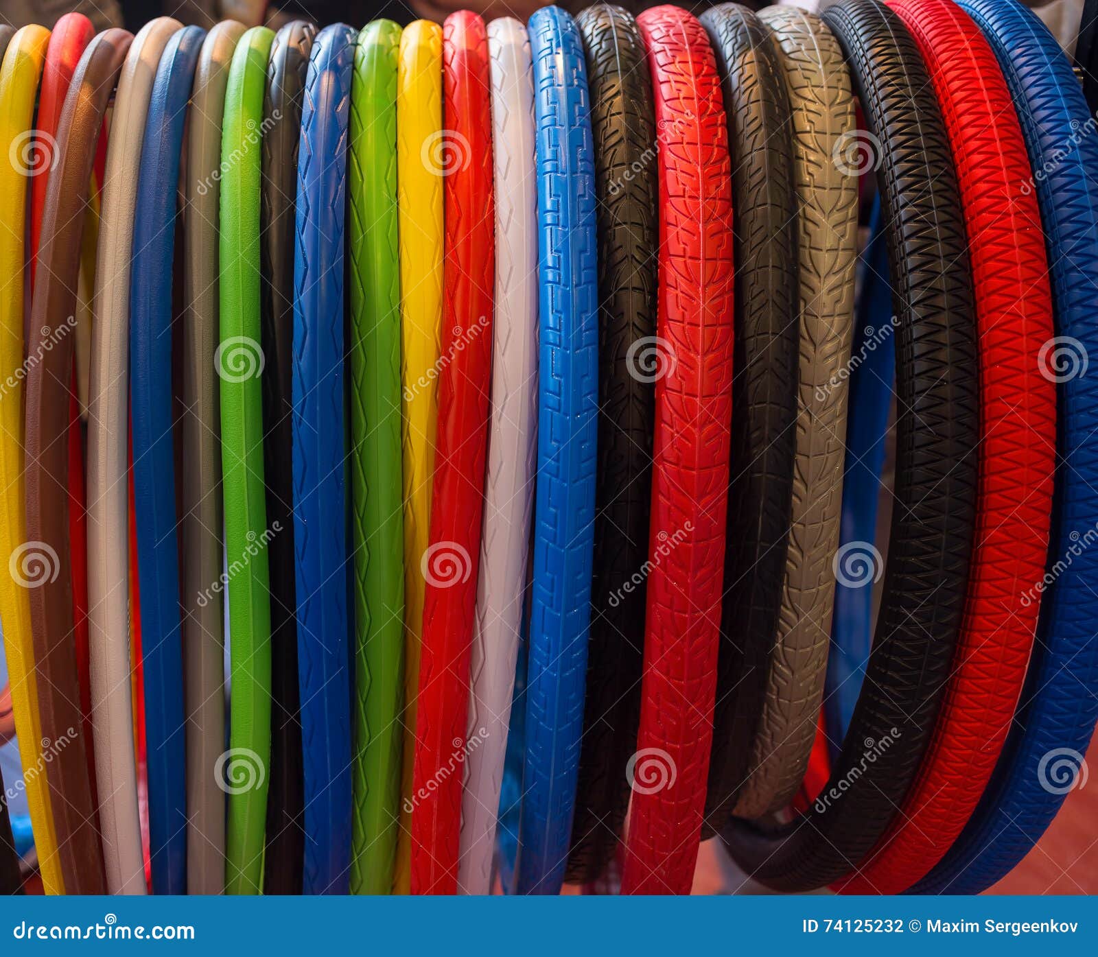 Many colored bicycle tires stock photo. Image of colored 74125232