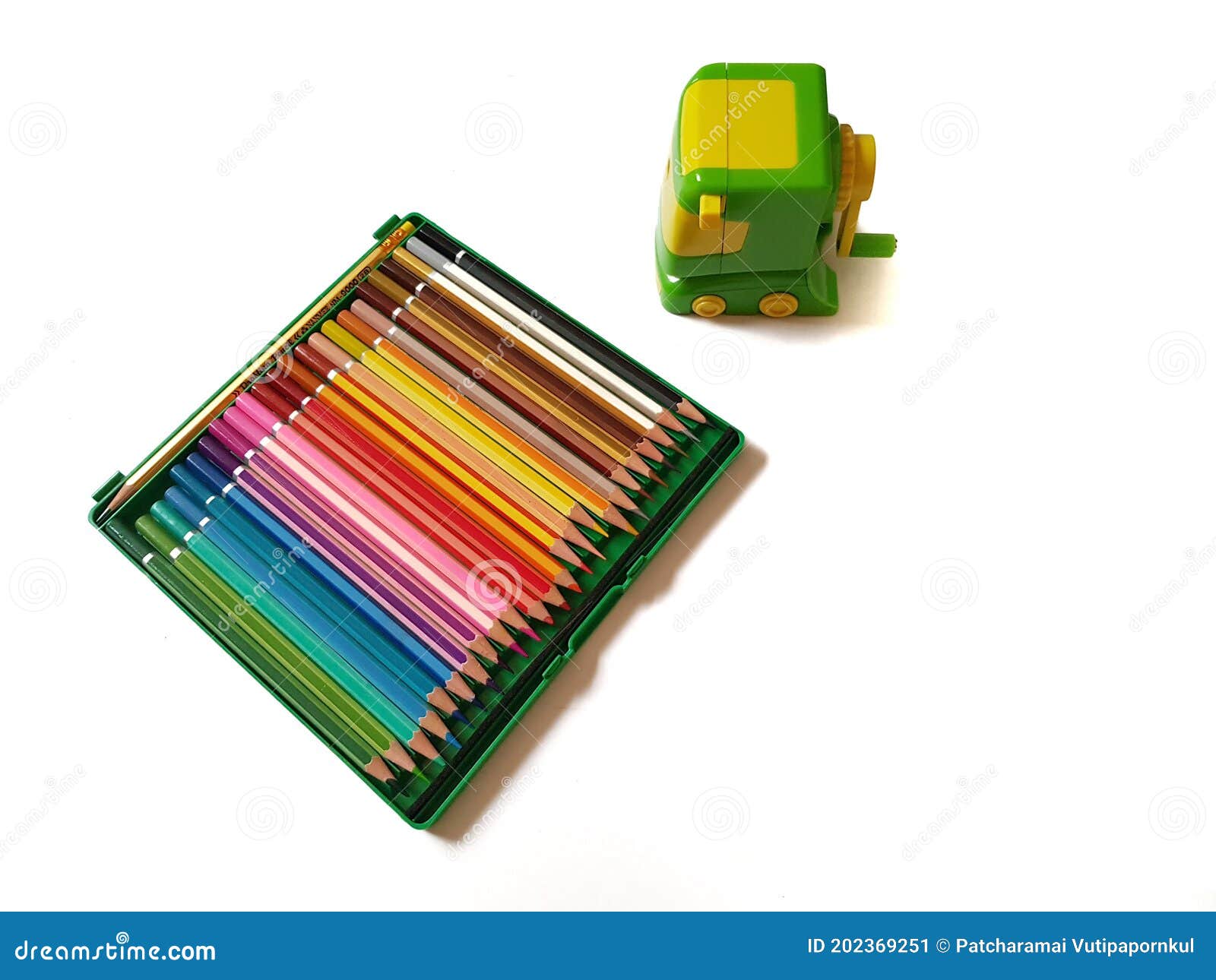 Many Colored Pencils with a Pencil Sharpener Get Ready for Use on a