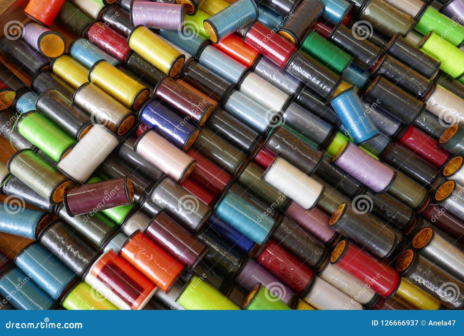 Many Colorful Original Packed Sewing Thread Rolls, Closeup, Background