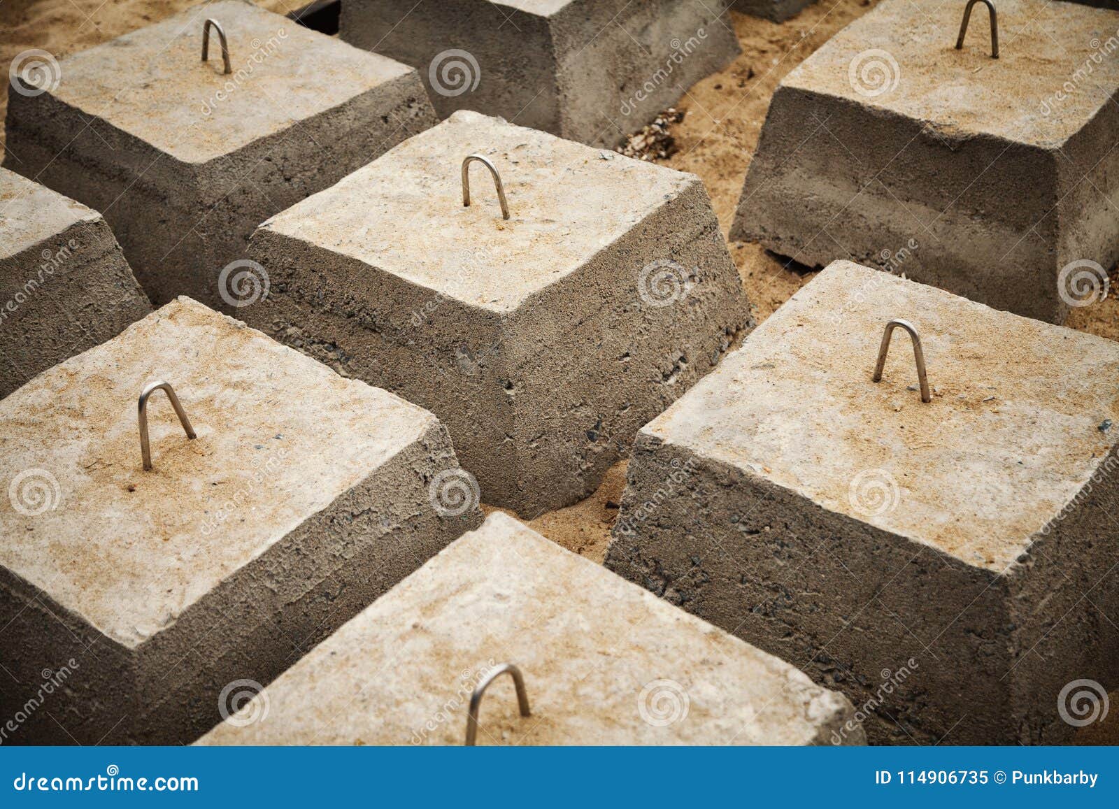 Many Concrete Blocks Arranged in Rows for a Building Foundation Stock