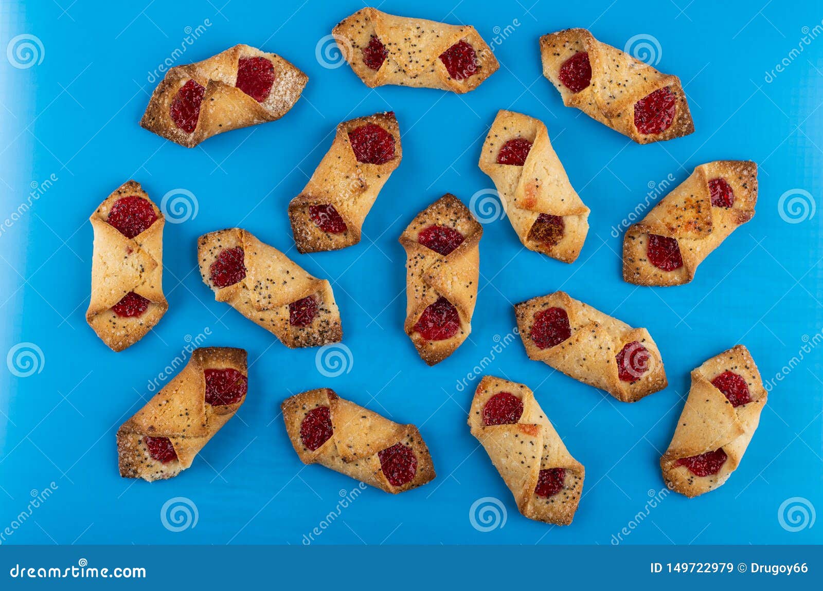 Many Envelope Cookies with Jam on Blue Table. Top View Stock Image