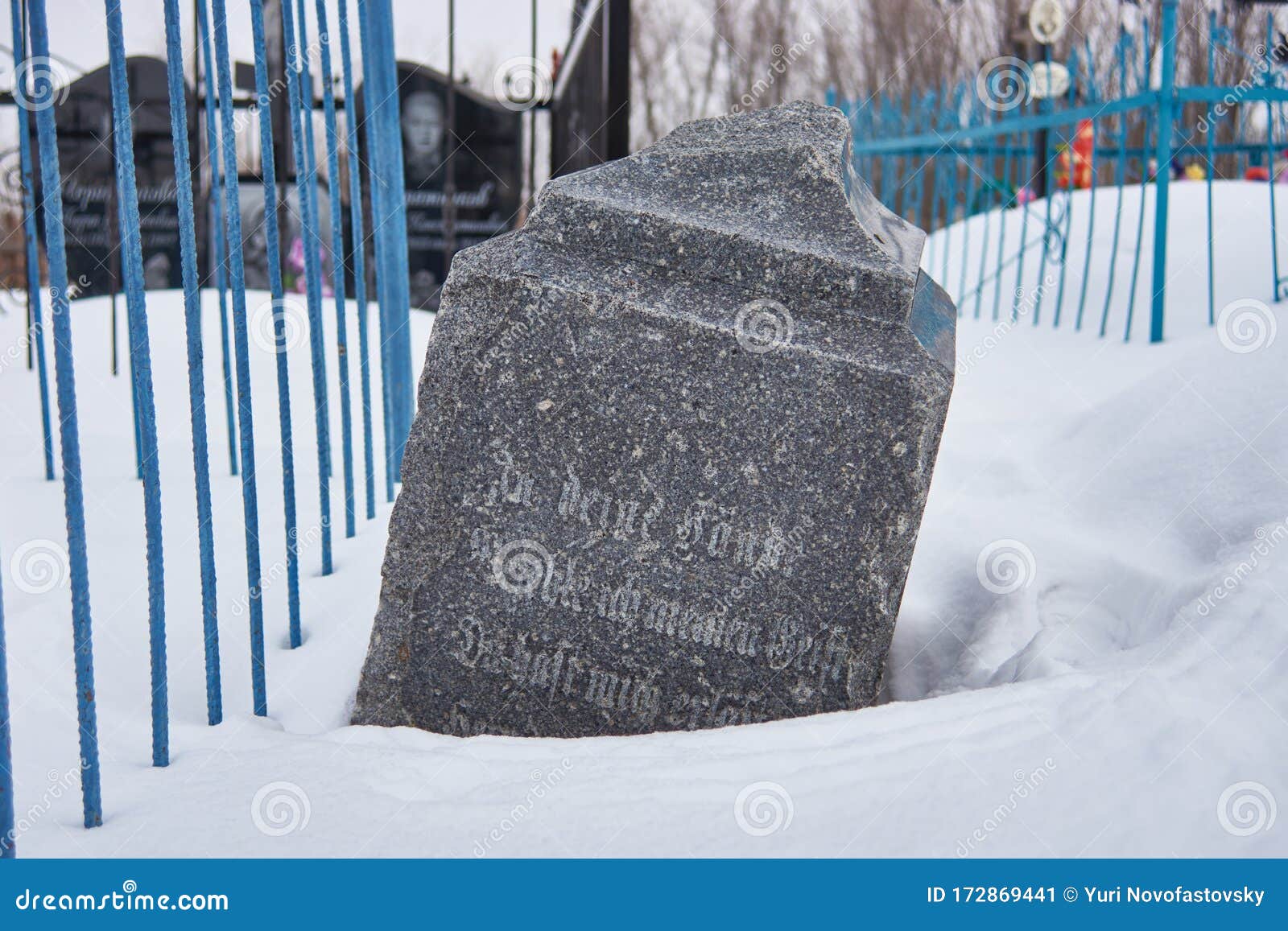 abandoned gravestone with gothic german letters
