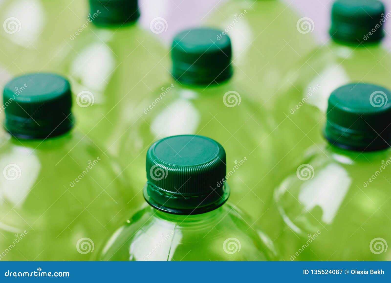 Many Green Plastic Bottles with Caps Stock Image - Image of beverage