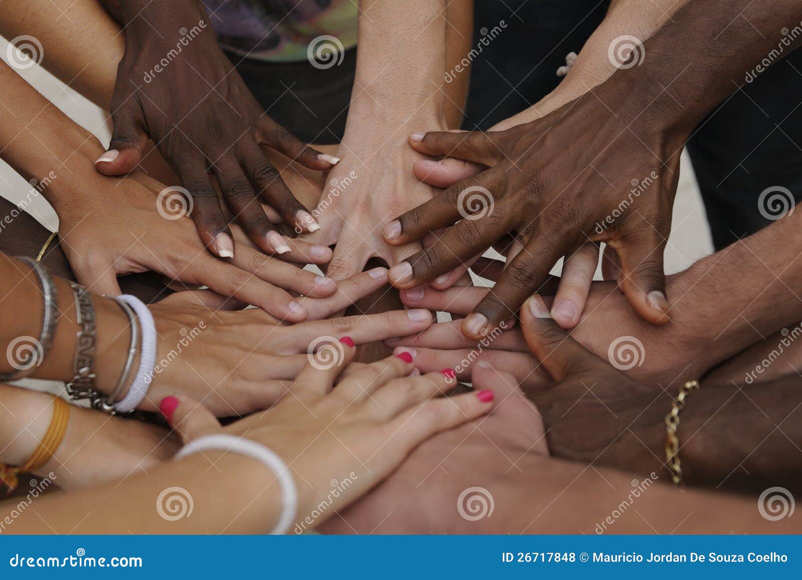 many hands together: group of people joining hands