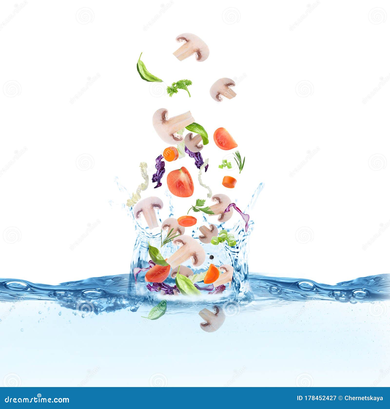 Many Ingredients Falling in Water with Splashes. Soup Recipe Stock