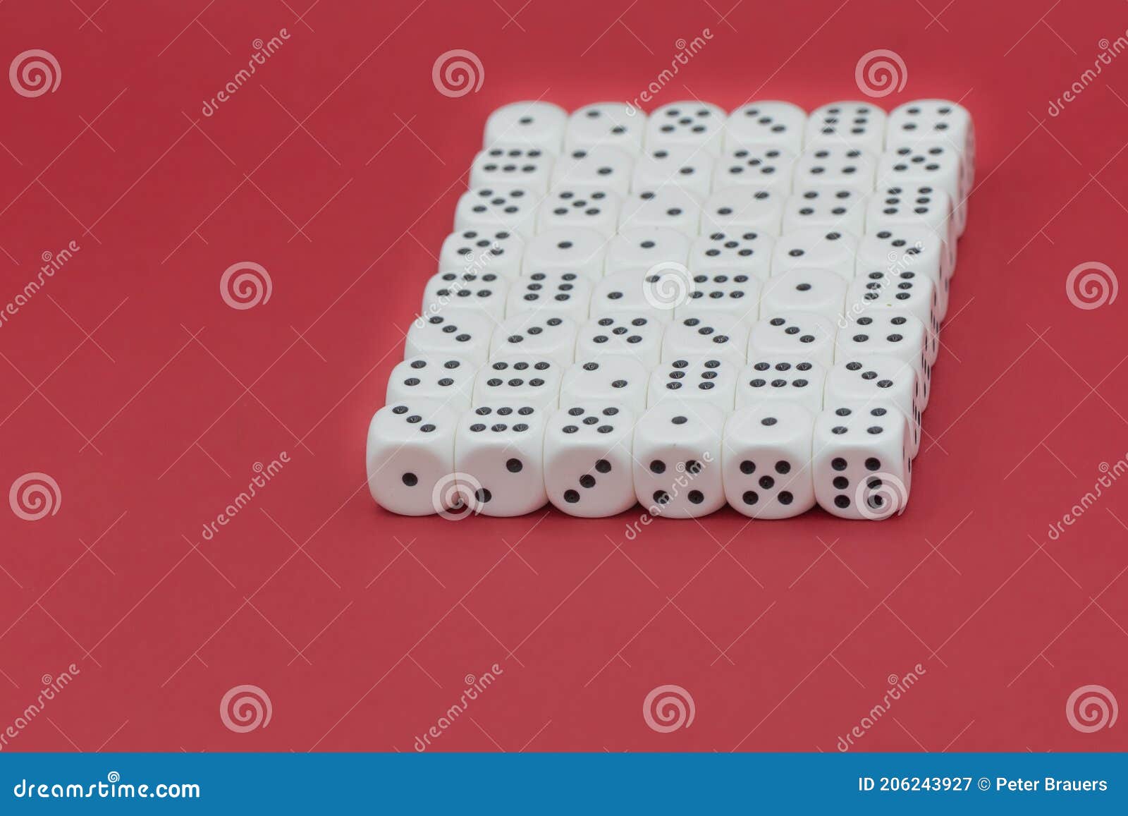quader of lined up cubes on a red background with copy space