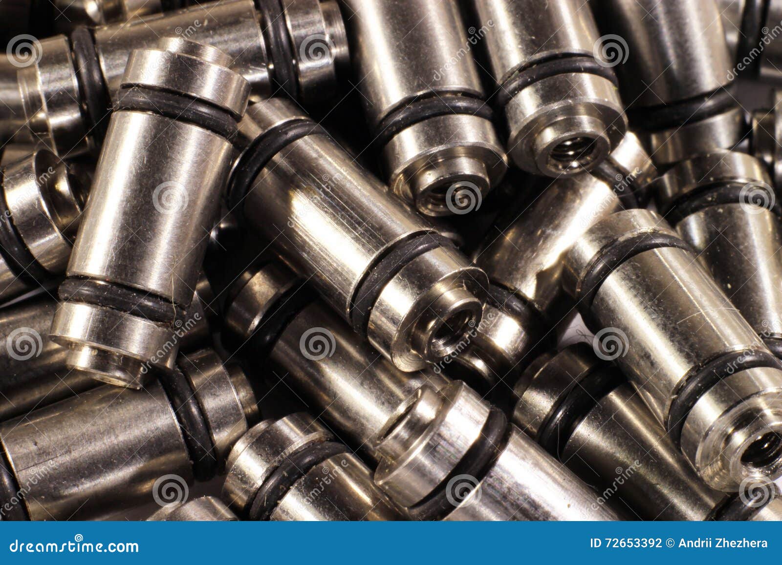 Many Metal Rods with Rubber Orings and Threaded Holes Stock Photo