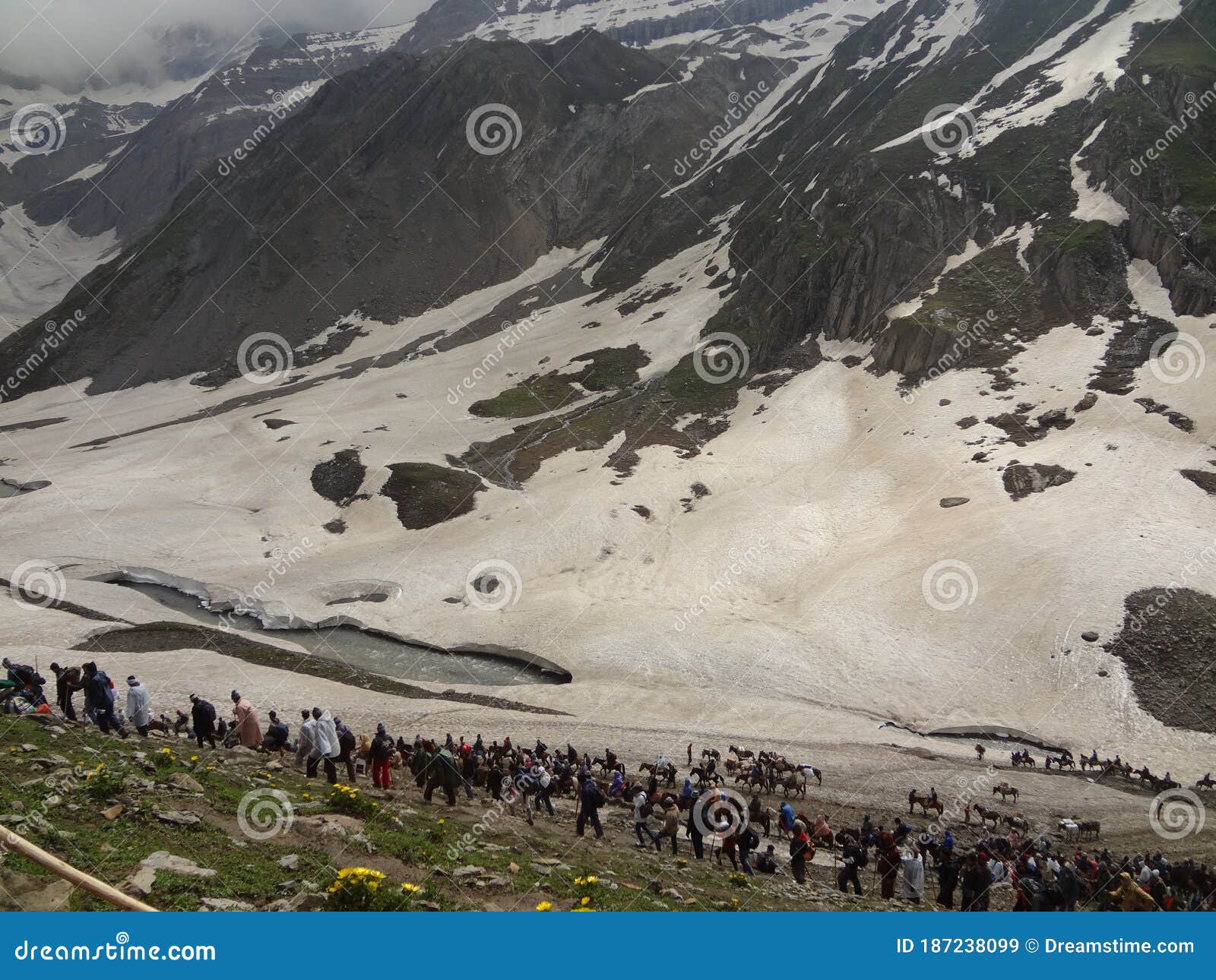 many people doing trecking on icy mountains