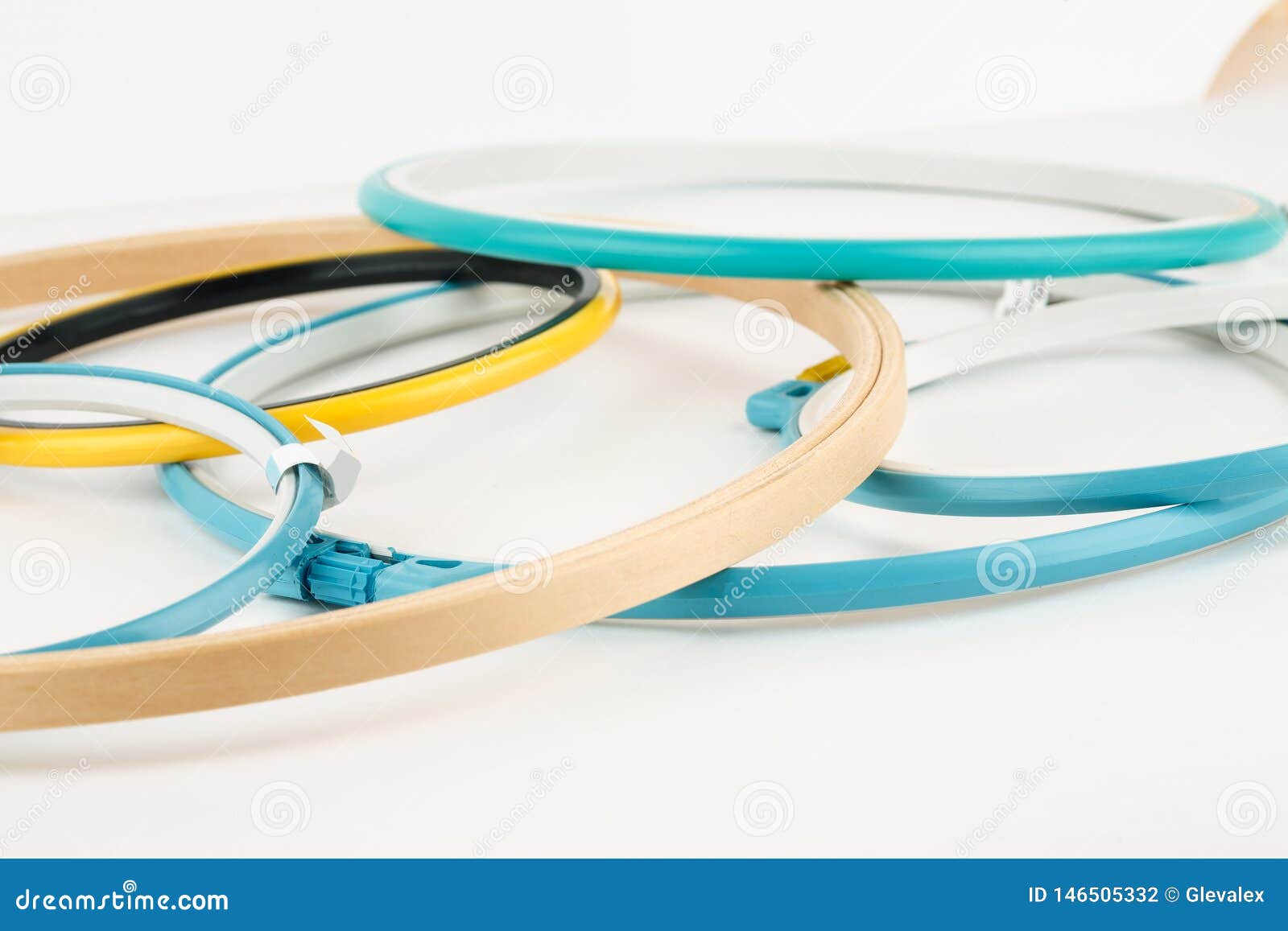 Many Plastic And Wooden Embroidery Frames On A White Background Stock