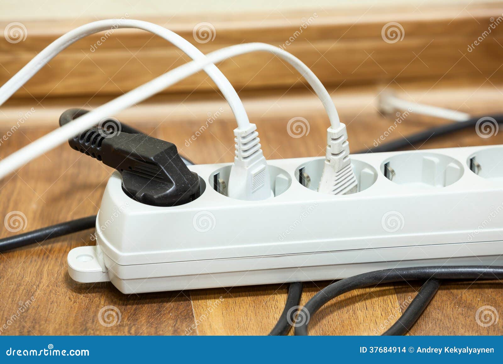 Many Plugs Plugged into Electric Power Bar Stock Photo Image of