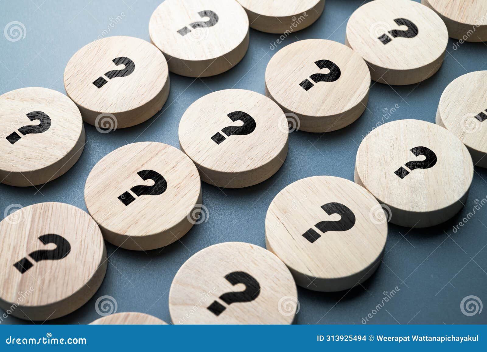 many question marks on round wood blocks arranged in the rows, many questions need the answers, system, processing, test, or faqs