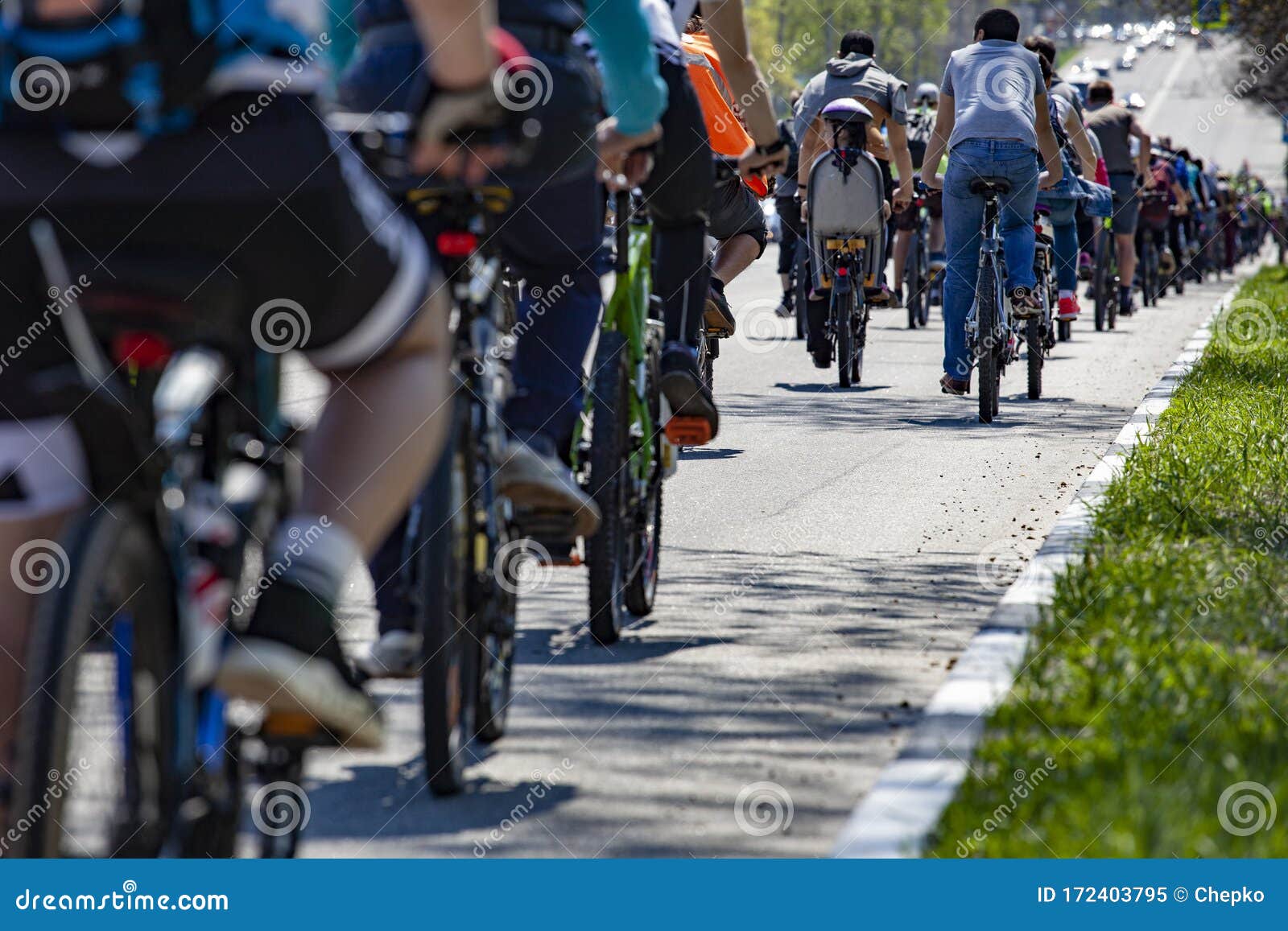 Many Racing Bikes. a Group of Cyclists Riding during the Street