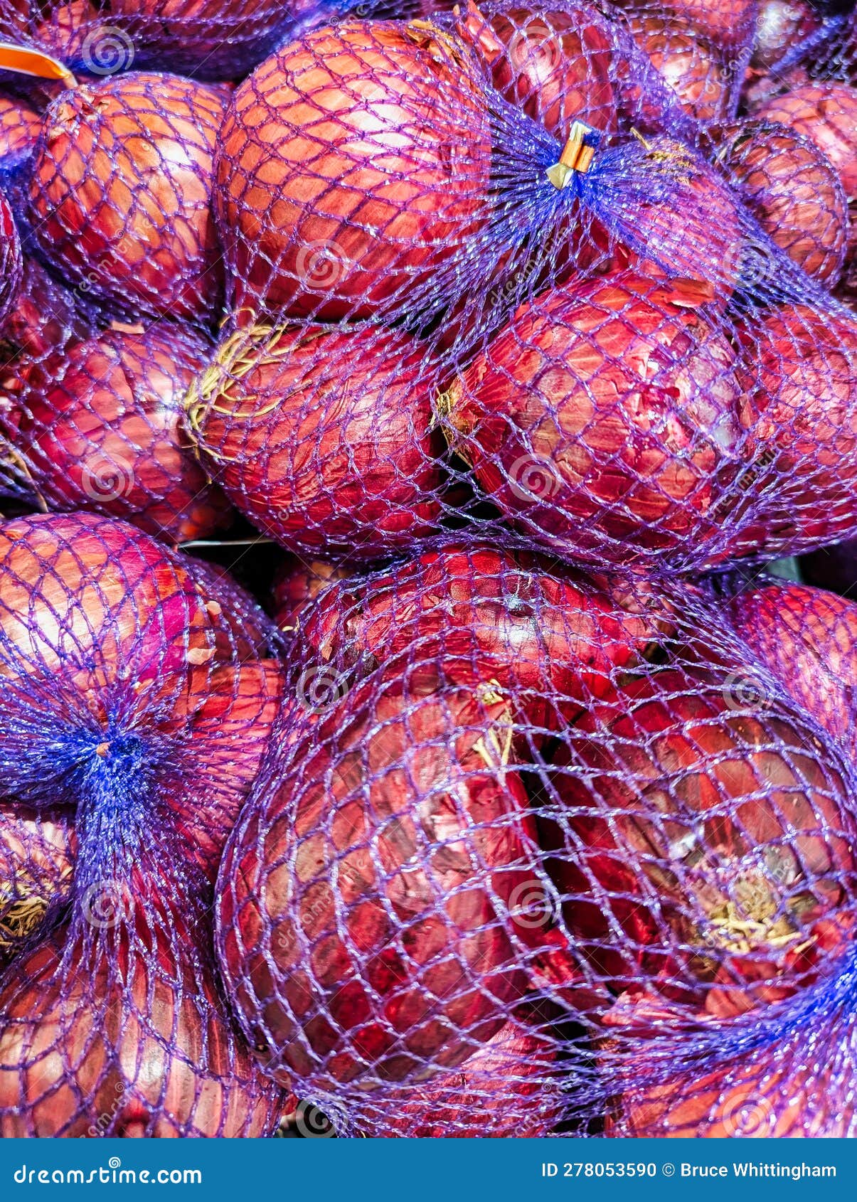 Many Red Onions in Purple Mesh Bags Stock Photo - Image of shop, bags:  278053590