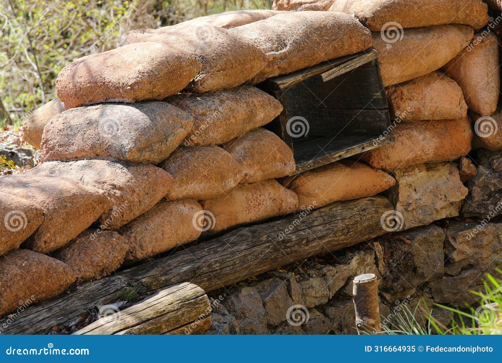 many sandbags of a trench dug in the ground to defend army soldiers from enemy raids