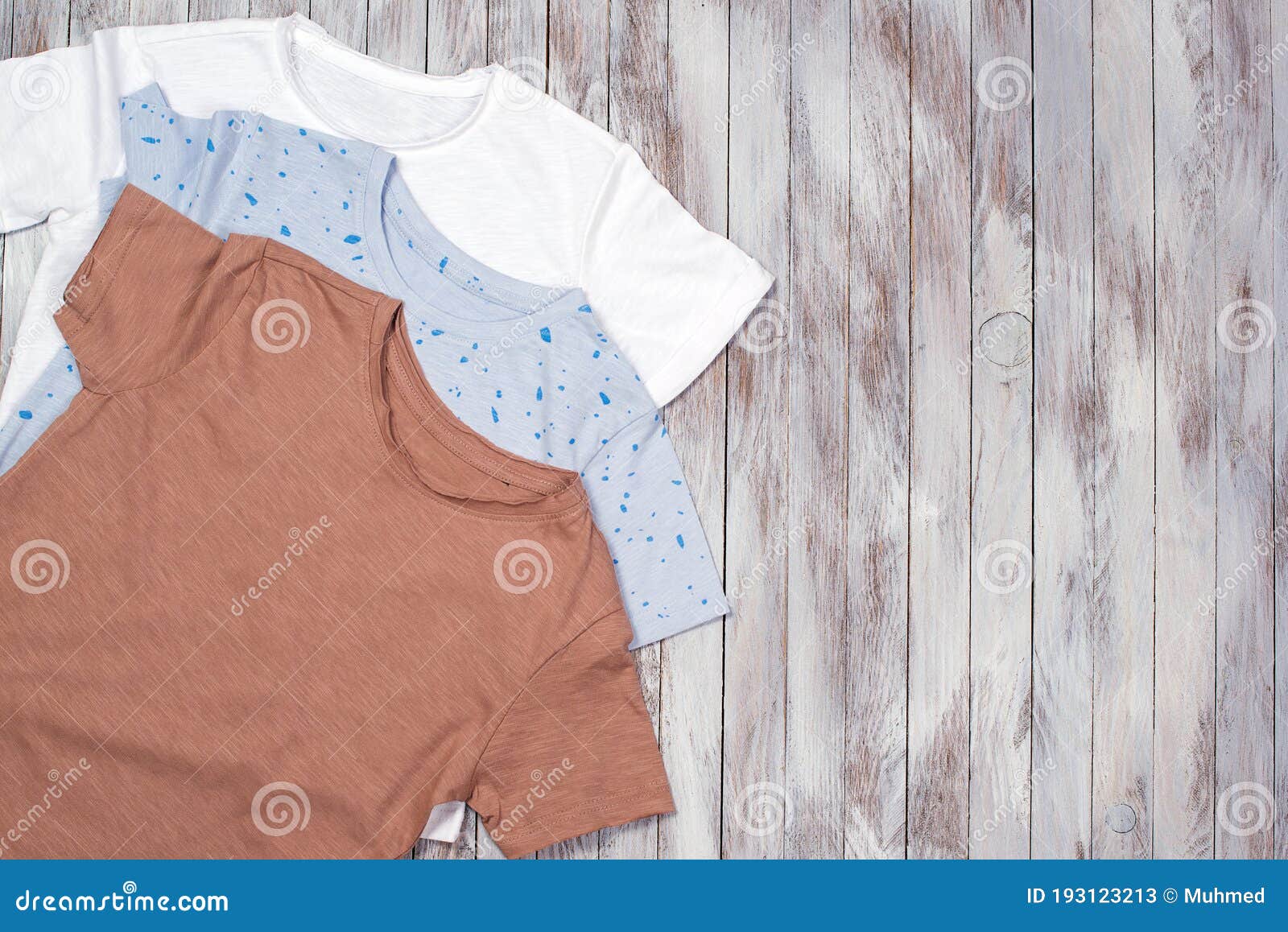 Download Many T-shirt On The Wooden Background. Fashion. Mockup ...