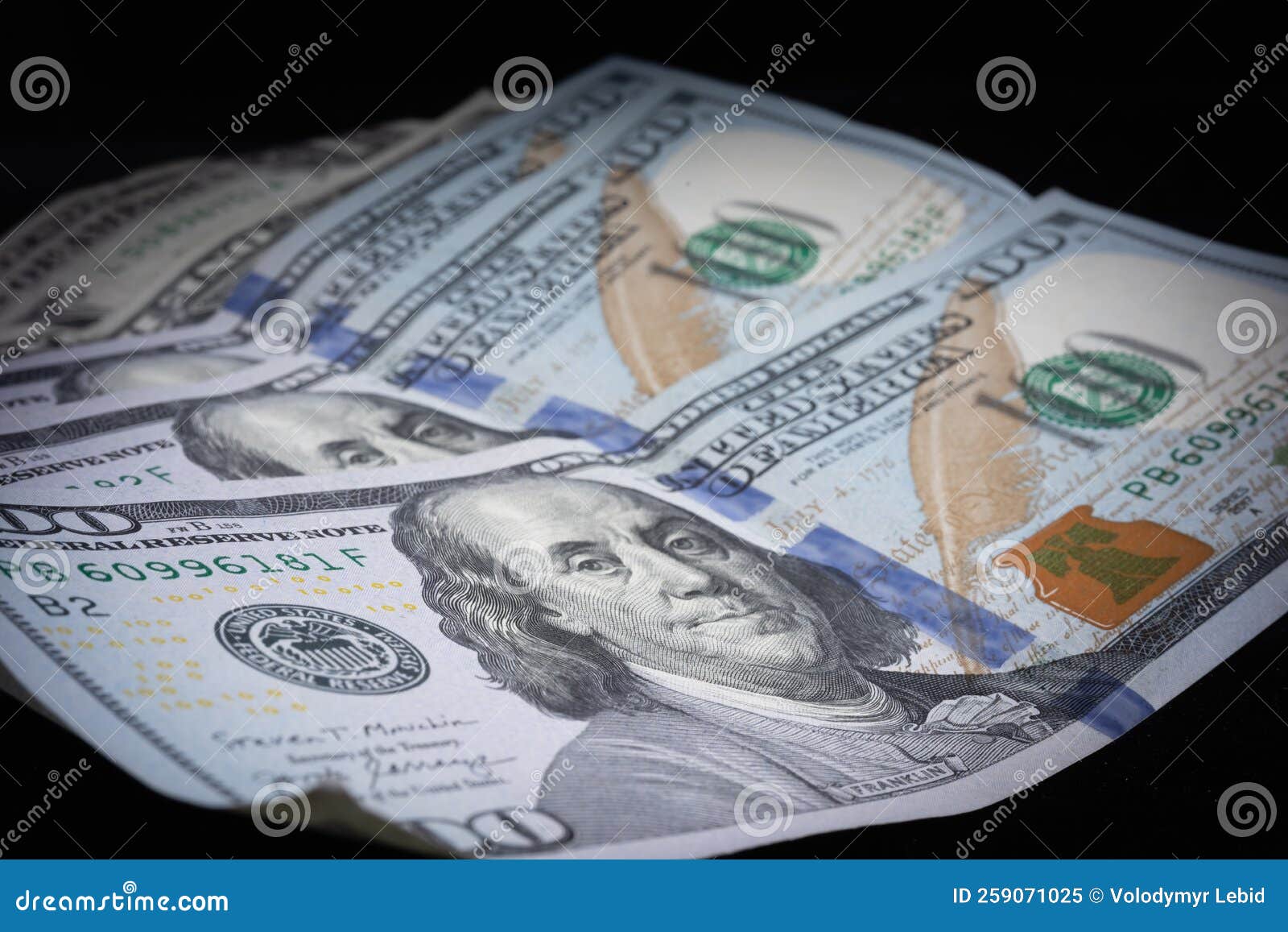 Many US Dollars Banknotes As Background. Photos in the Low Key Stock