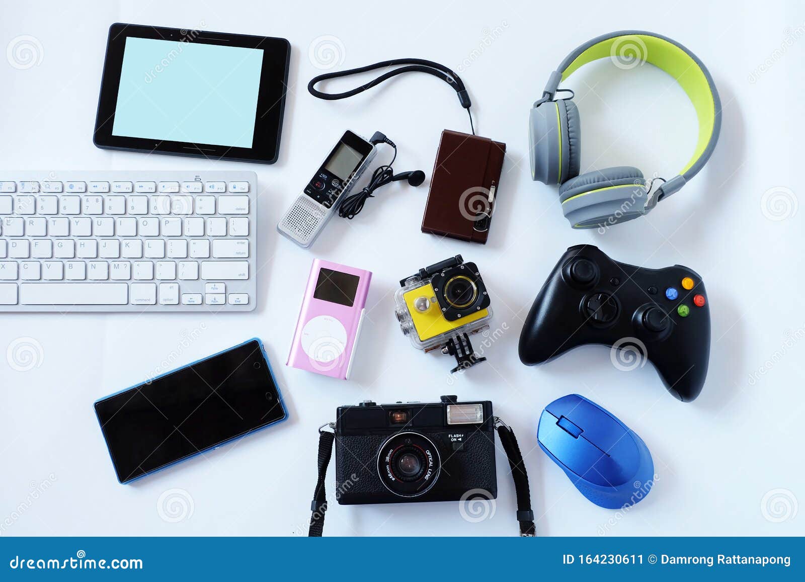 many used modern electronic gadgets for daily use on white floor, reuse and recycle concept