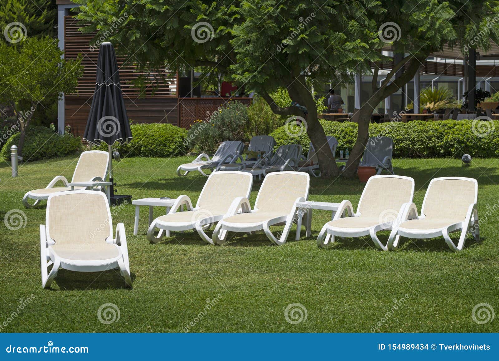 Many white deck chairs stock photo. Image of relaxation 154989434