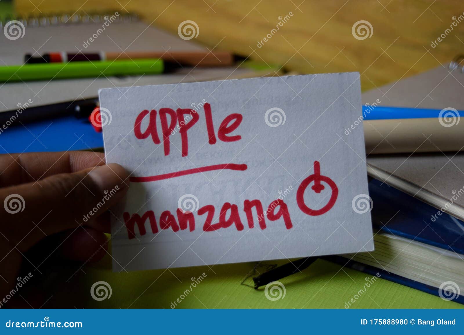 manzana write on a sticky note  on office desk. learning spanish language concept