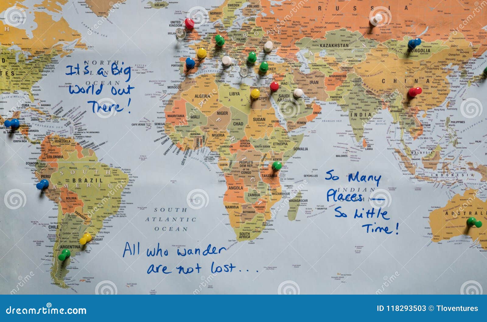 map with push pins and travel quotes