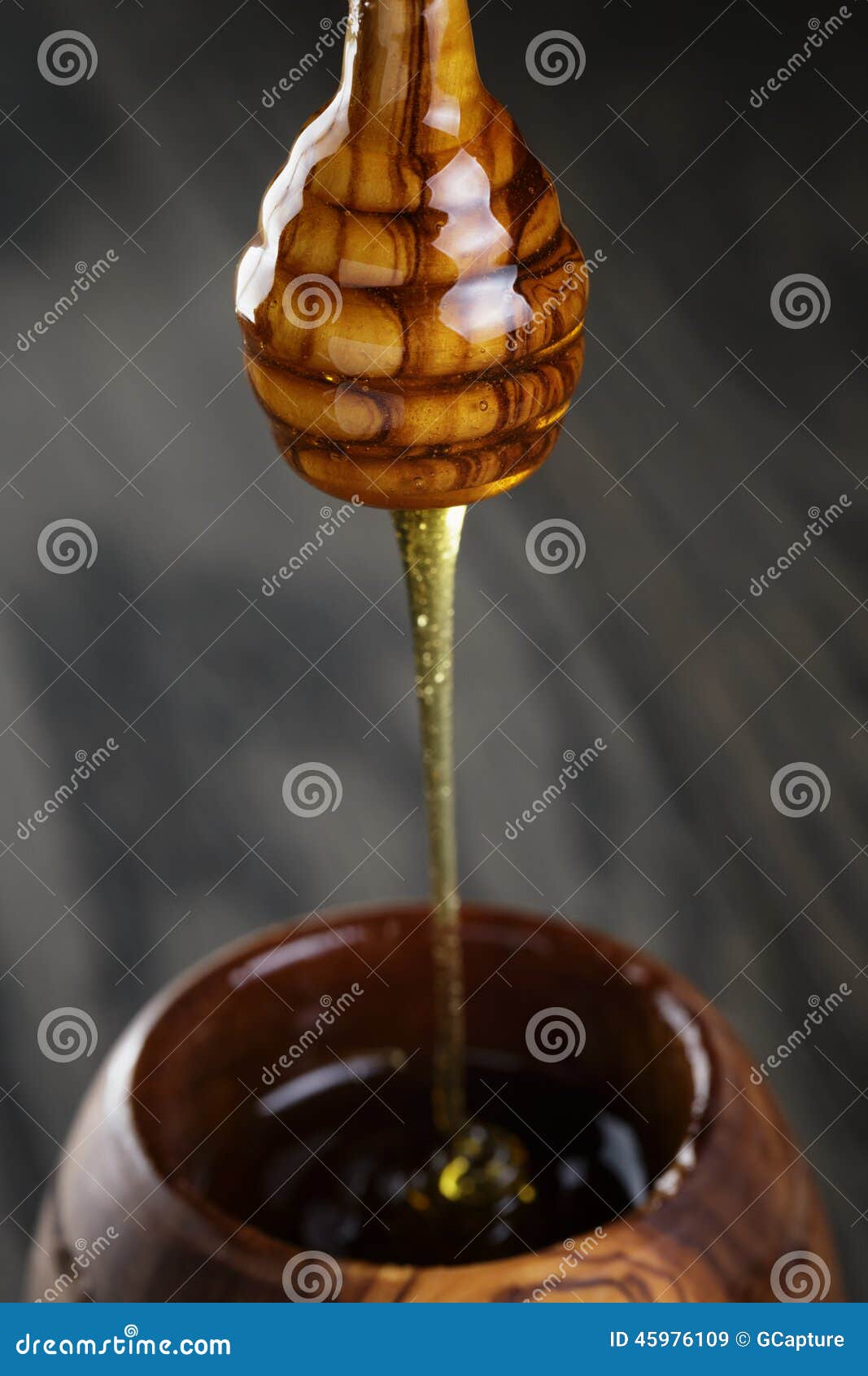 Maple Honey Flowing from Dipper To Pot Stock Image Image of studio