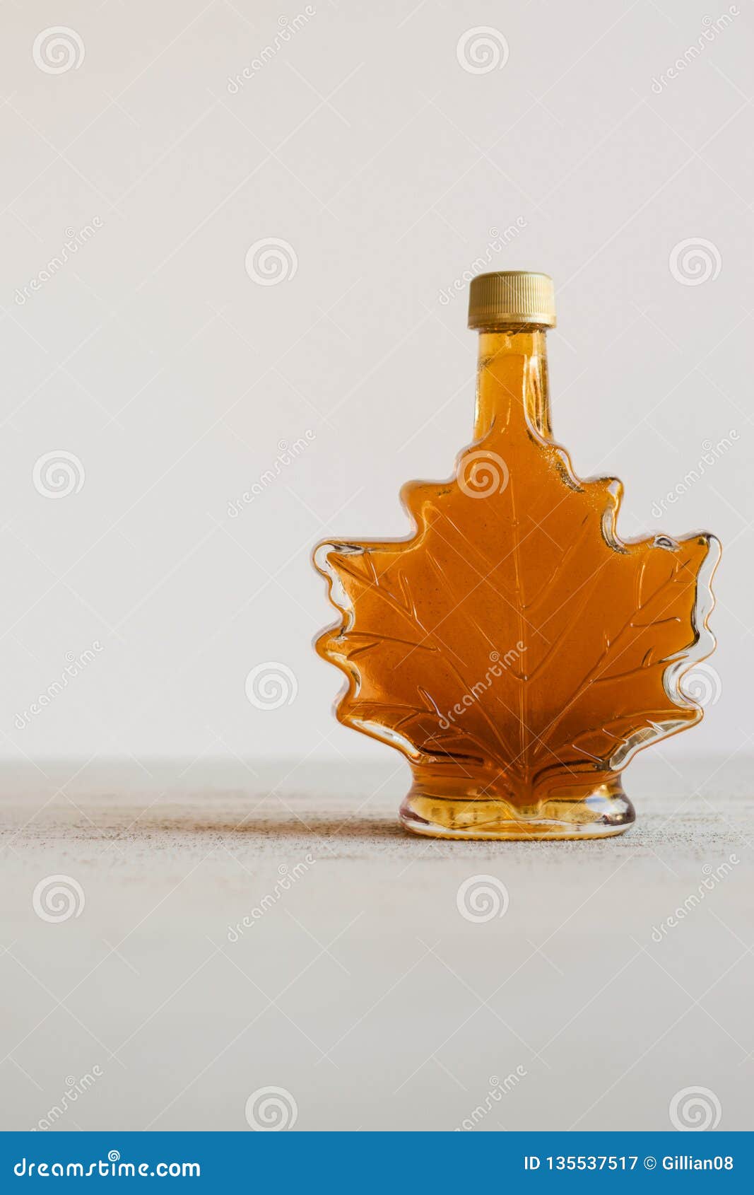 Maple syrup in leaf bottle stock image. Image of background 135537517