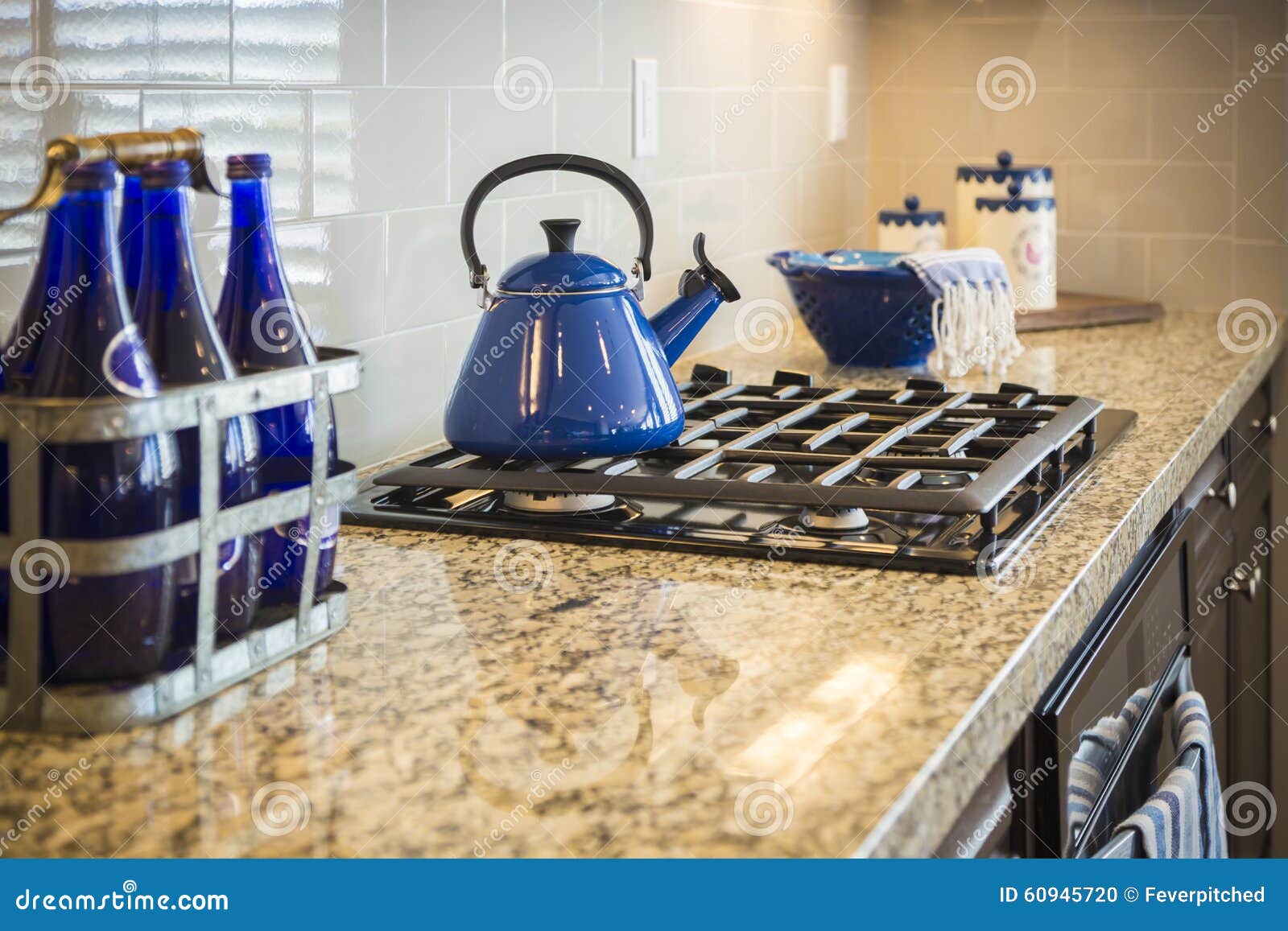Marble Kitchen Counter and Stove with Cobalt Blue Decor Stock Photo