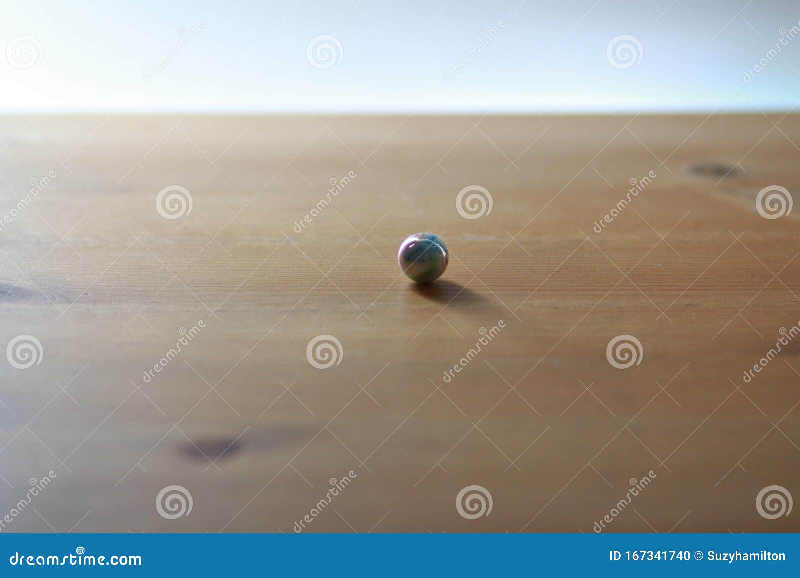 marble small on wooden table close up landscape format