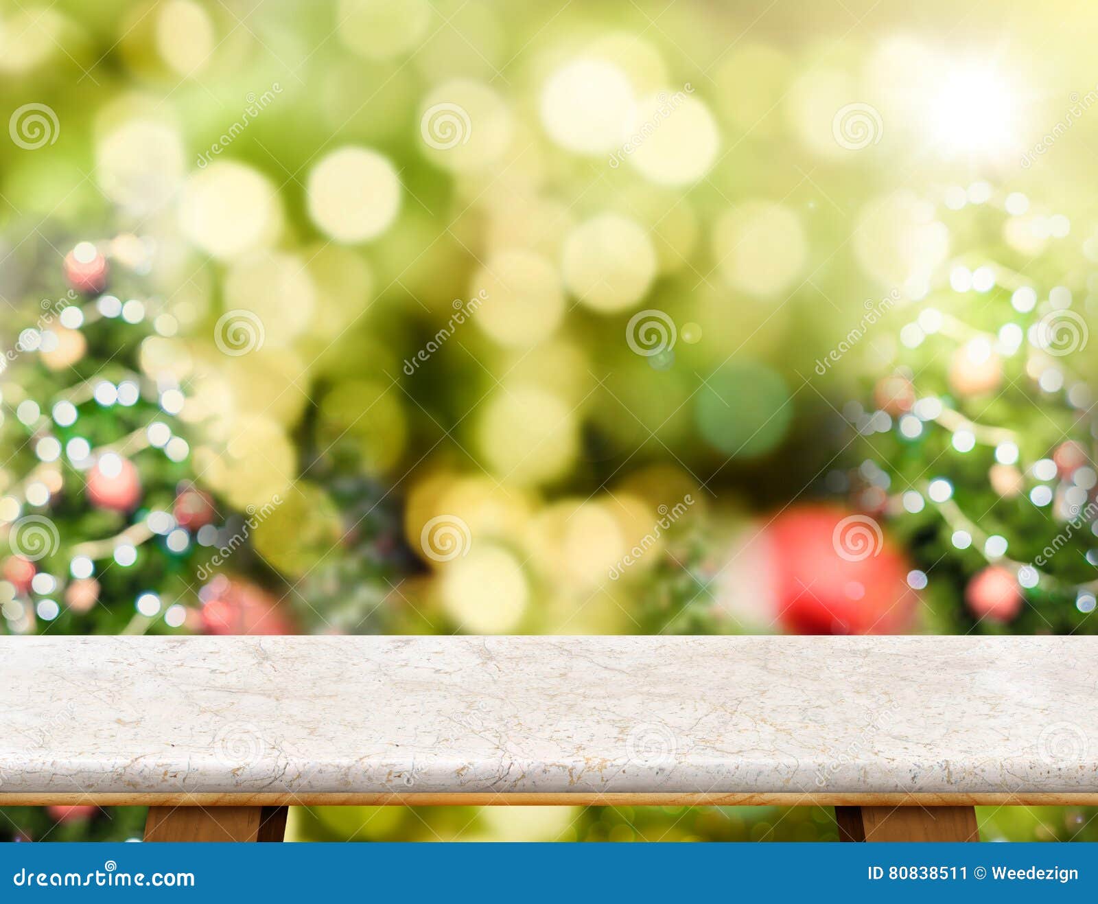 Marble table top with abstract blur christmas tree background wi