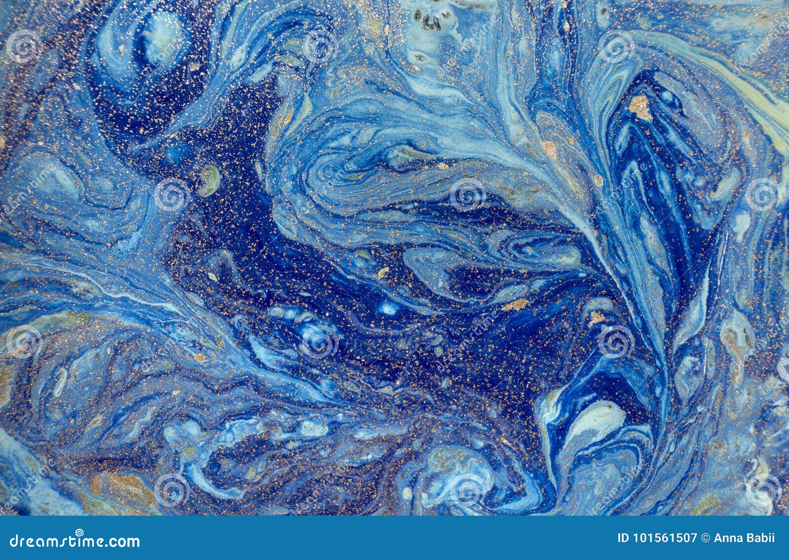 marbled blue abstract background with golden sequins. liquid marble ink pattern.
