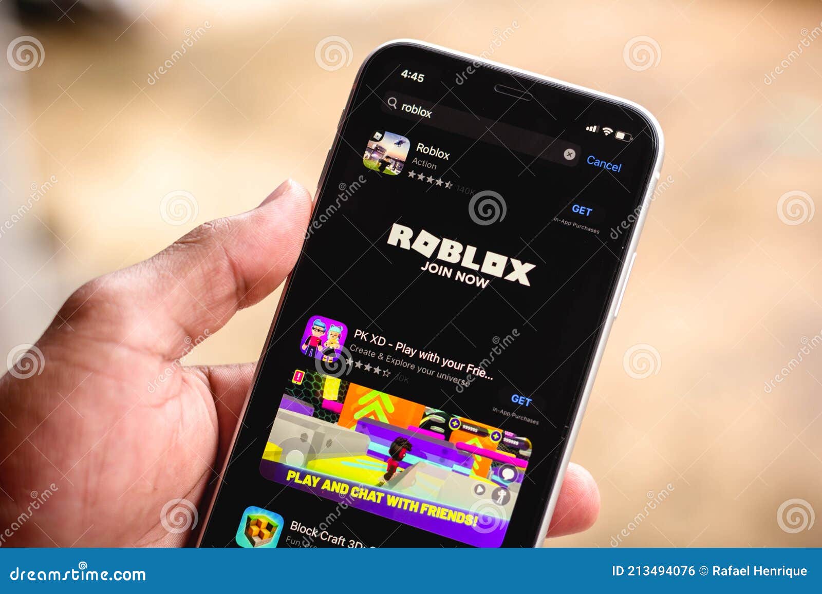 Roblox Logo and App on a Mobile Screen in a Hand Editorial Stock