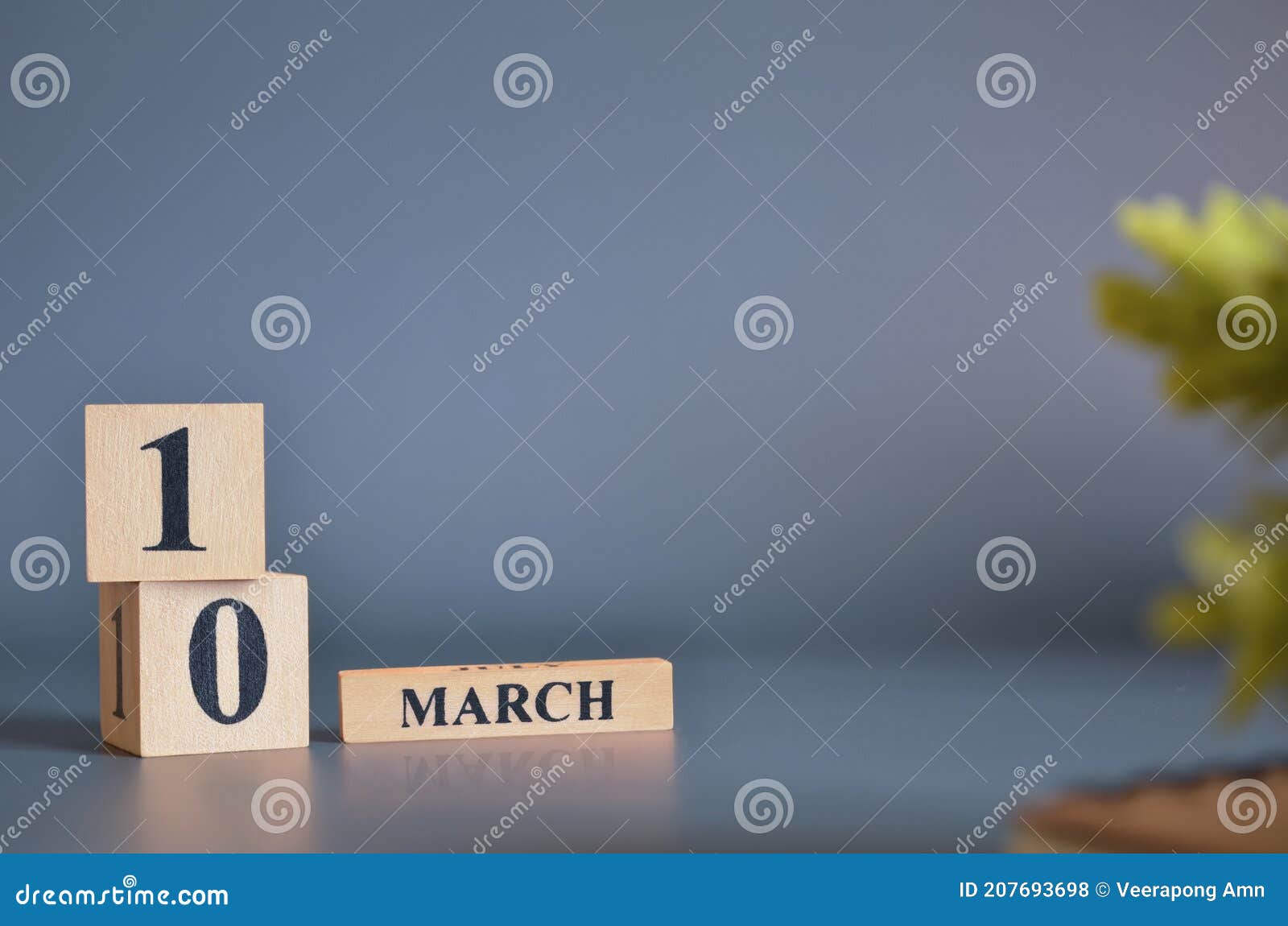 march 10, cover in the evening time, date  with number cube for background.