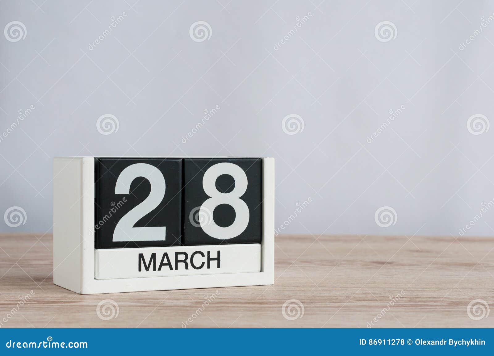 March 28th. Day 28 of Month, Wooden Calendar on Light Background