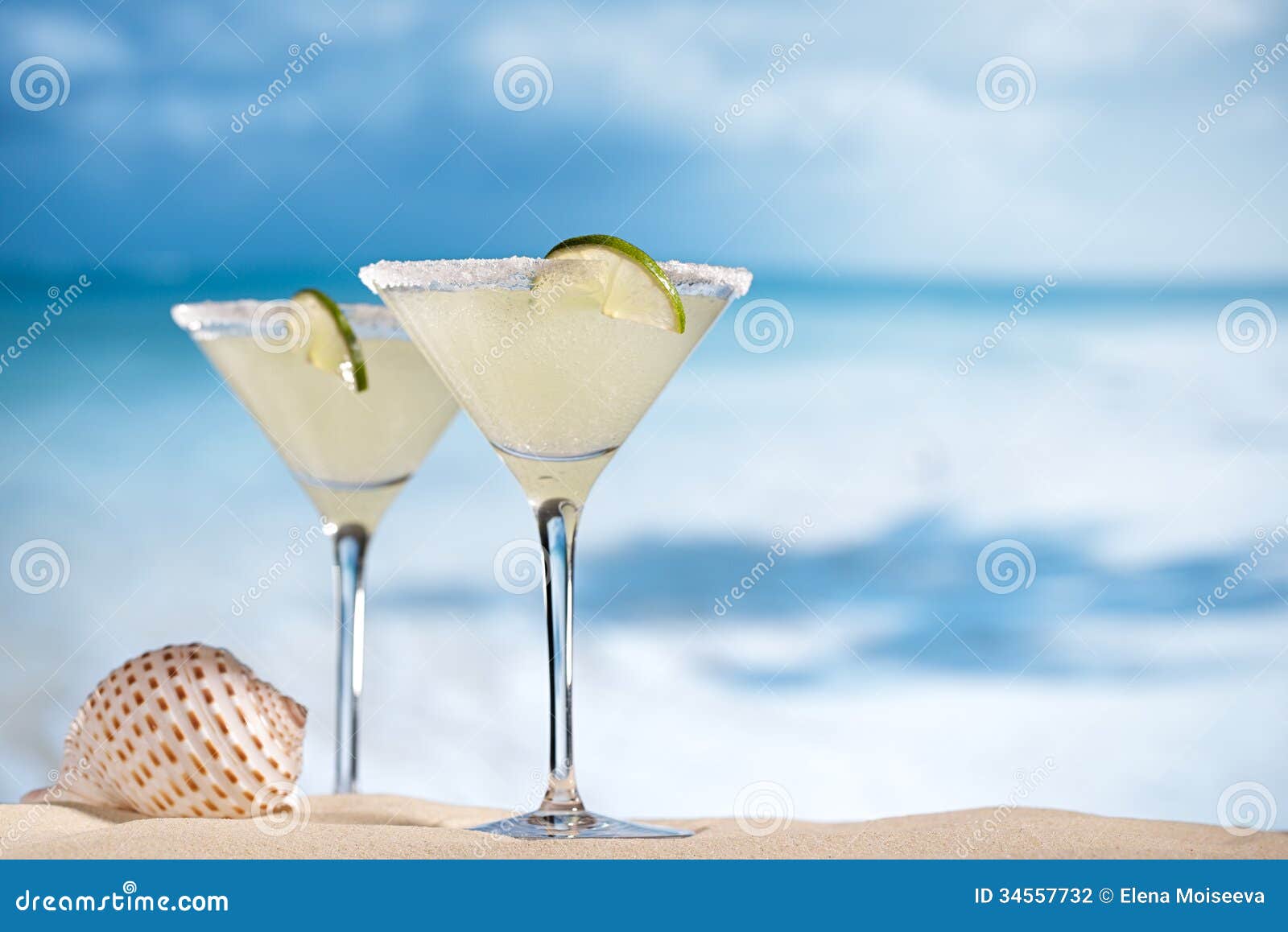 margarita cocktail on beach, blue sea and sky
