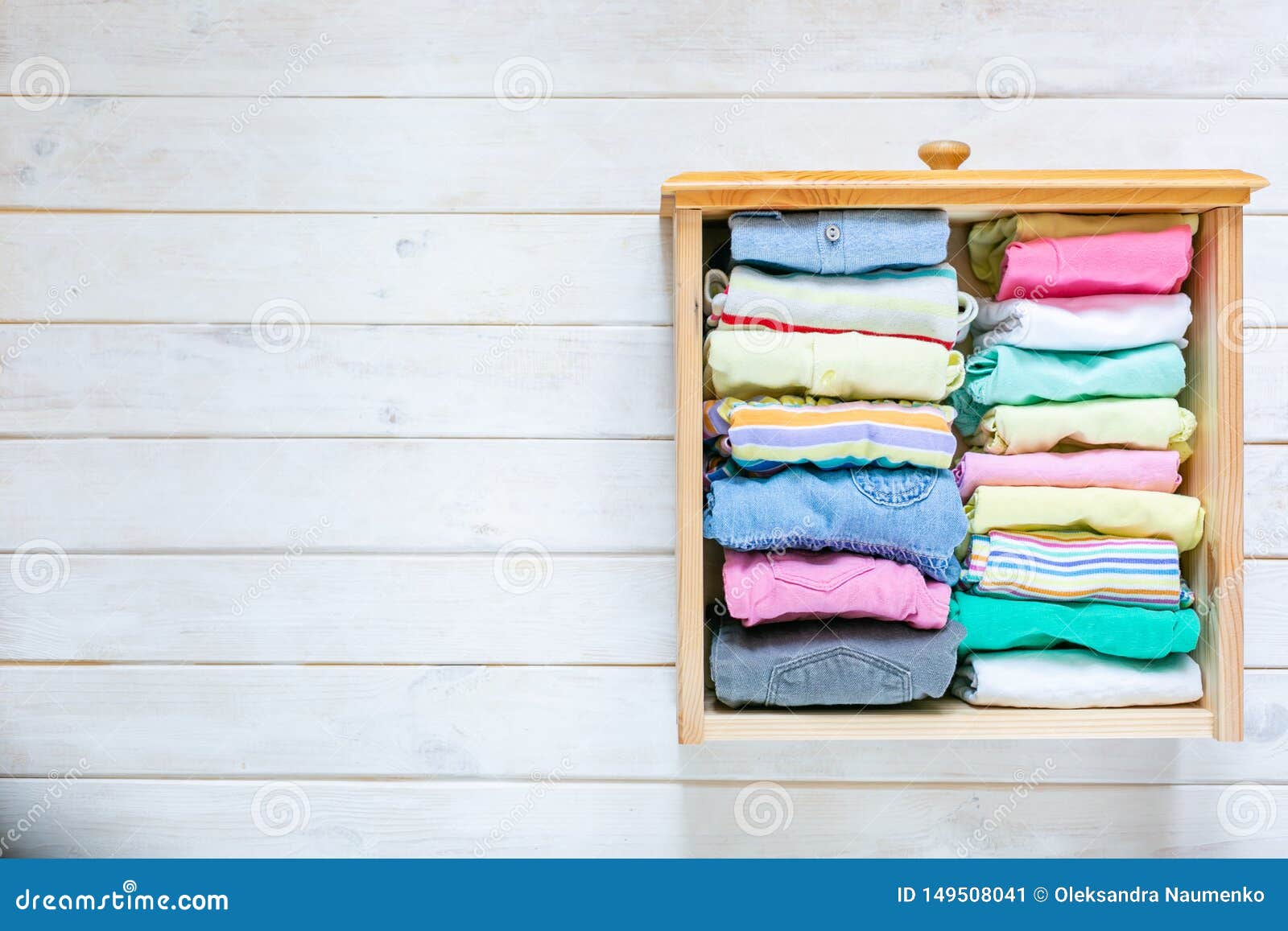 marie kondo tyding up method concept - folded clothes