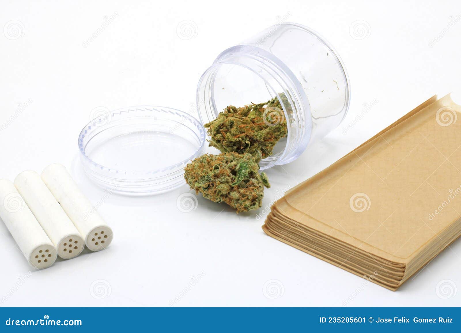 Marijuana Buds in a Clear Pot Accompanied by Smoke Paper and Insulated ...