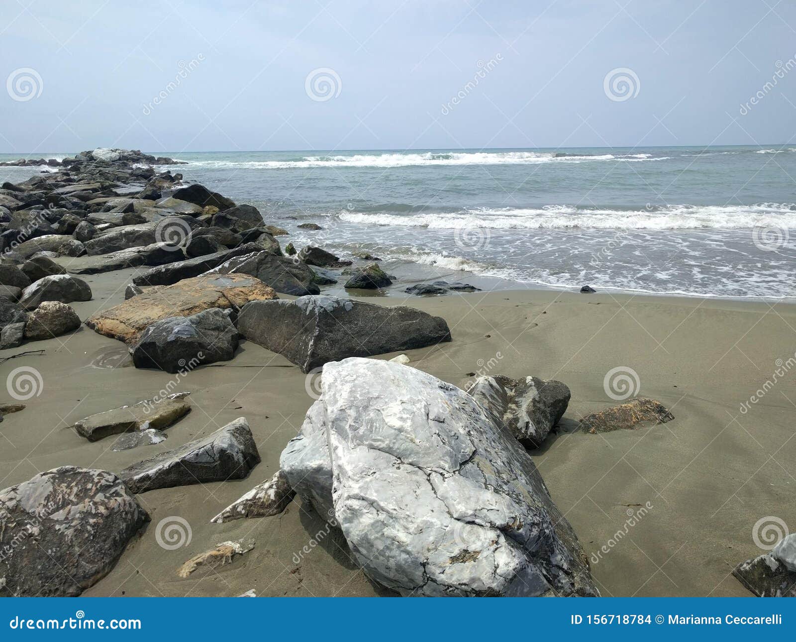 marina di massa - tuscany - 8 july 2019: overview of a cliff along a versilia beach